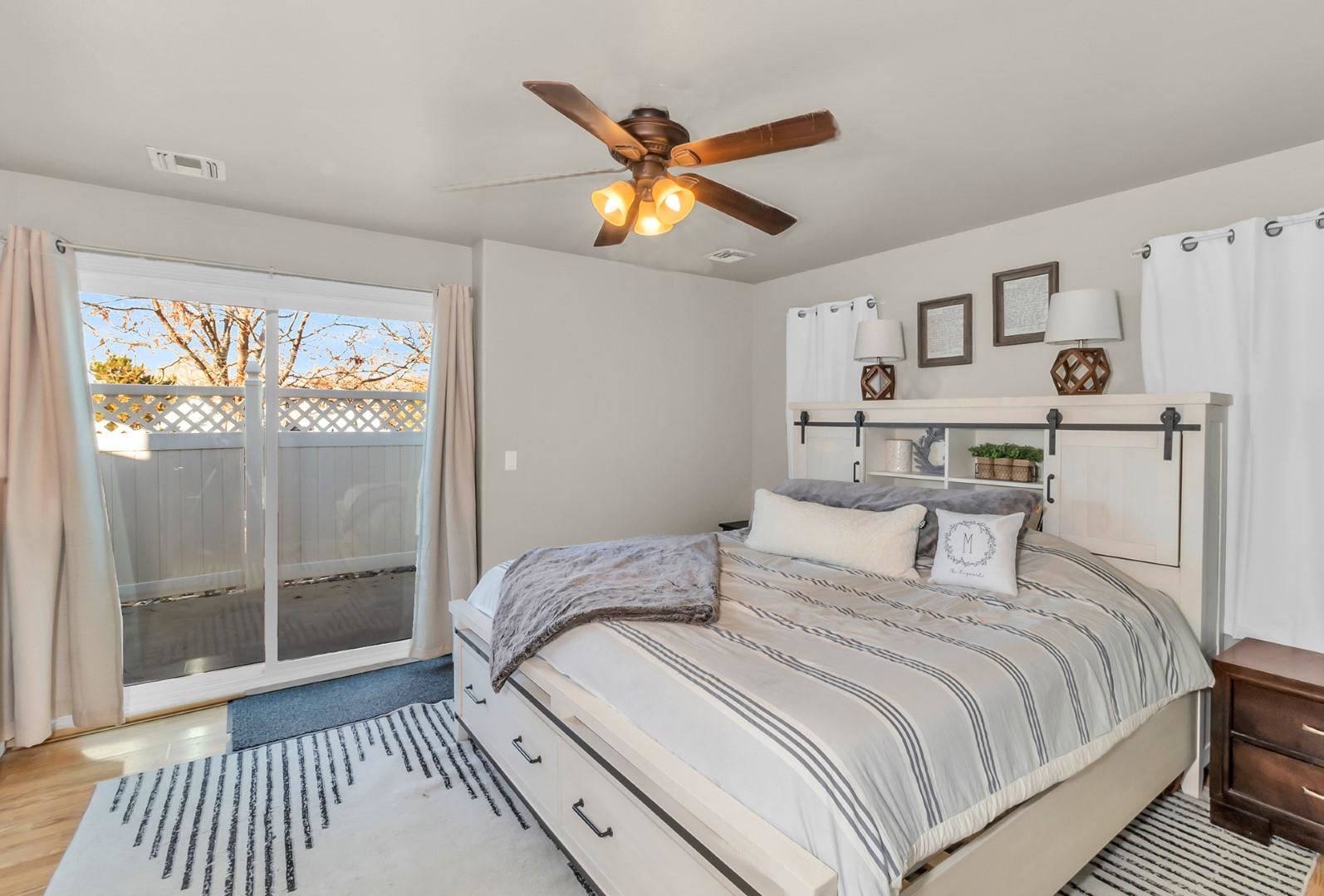 1209 Windsor Park Drive Fruita, CO 81521 - Photo 7 of 26 a bedroom with a bed and a window