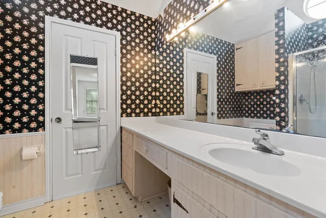 a bathroom with a sink and a mirror