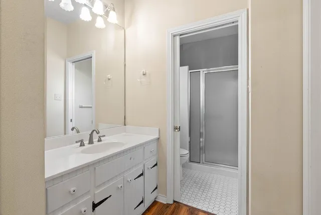 a bathroom with a sink vanity and mirror