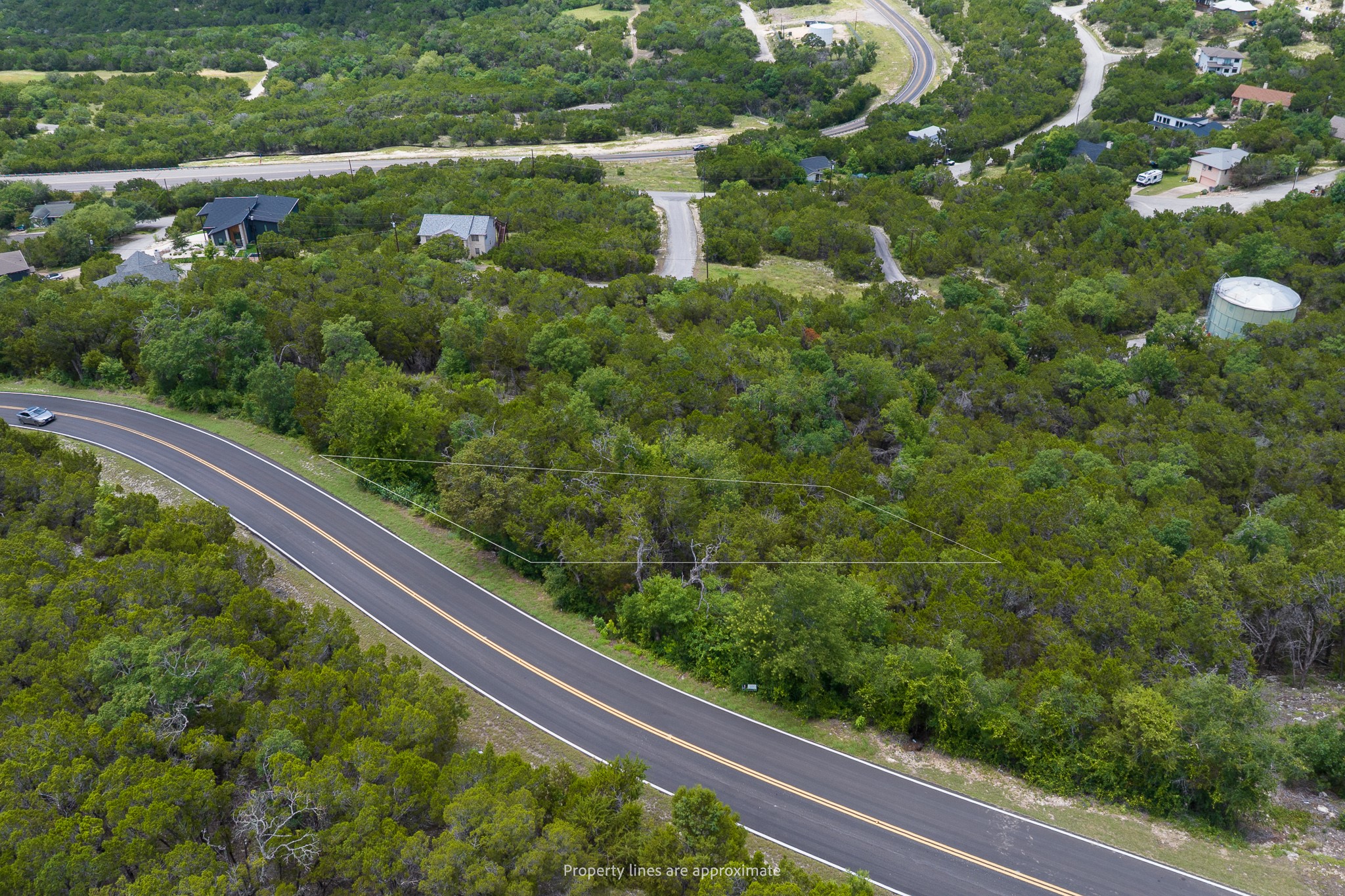 8220 Bar K Ranch Road Lago Vista, TX 78645 - Photo 4 of 8 Vast, verdant terrain offers a secluded setting for a dream home.