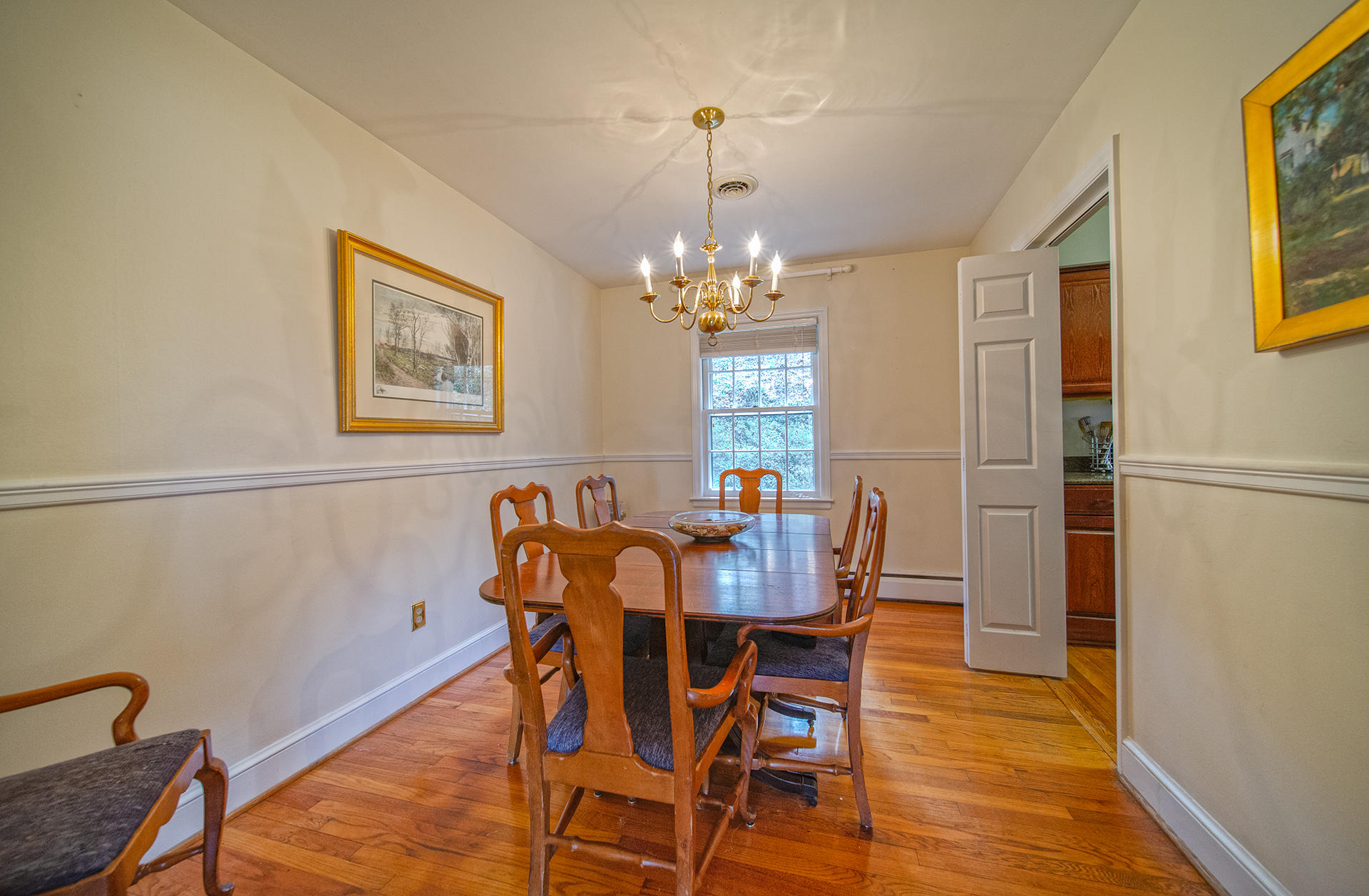 3120 Stoneridge Road Southwest Roanoke, VA 24014 - Photo 2 of 35 a view of a dining room with furniture and chandelier