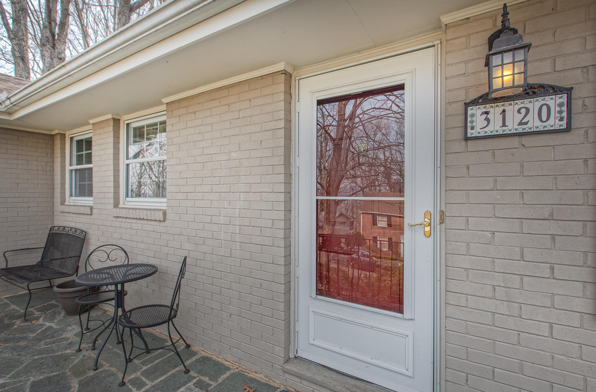 3120 Stoneridge Road Southwest Roanoke, VA 24014 - Photo 28 of 35 a brick building with a bench and a window