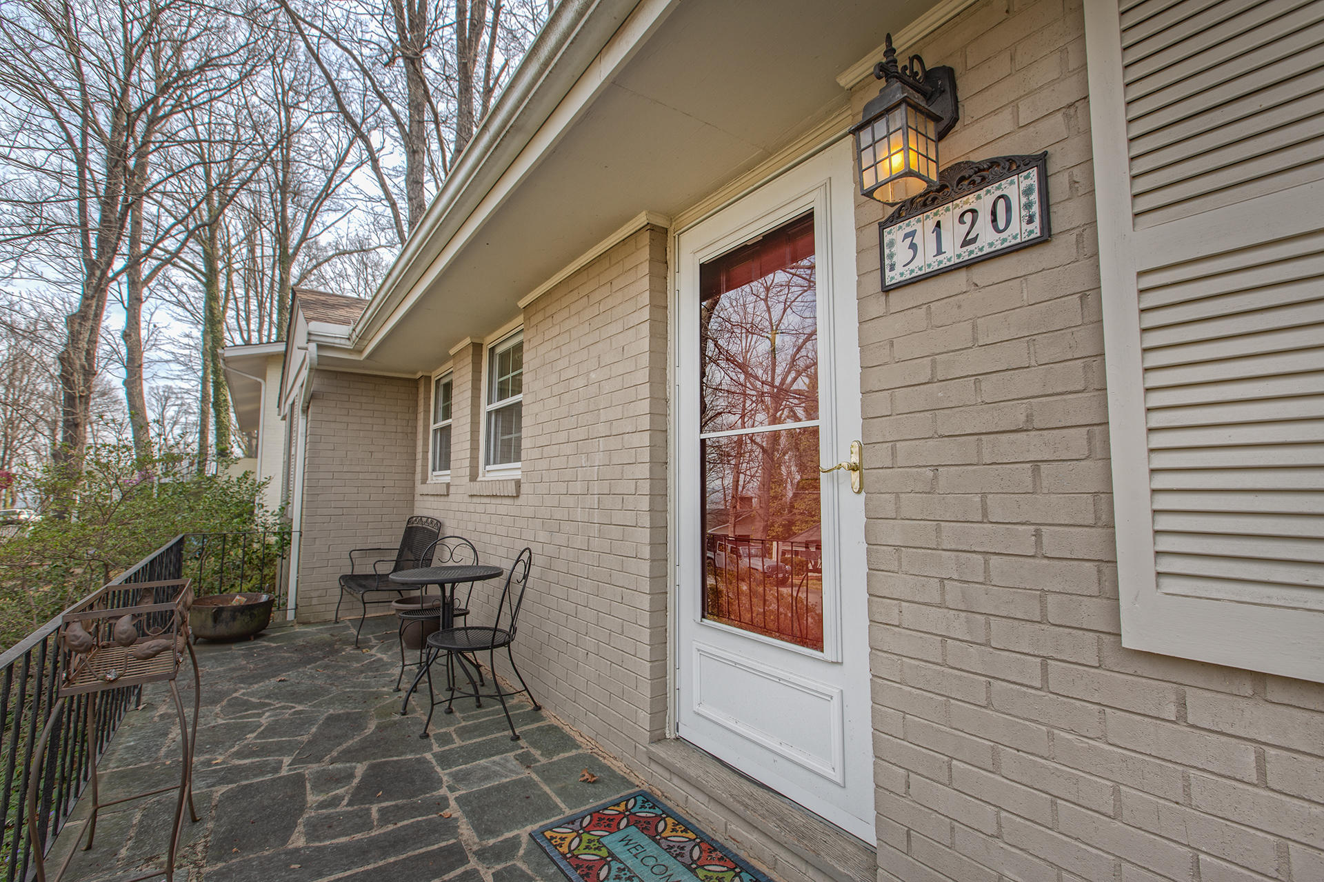 3120 Stoneridge Road Southwest Roanoke, VA 24014 - Photo 29 of 35 a brick building with a bench and potted plant