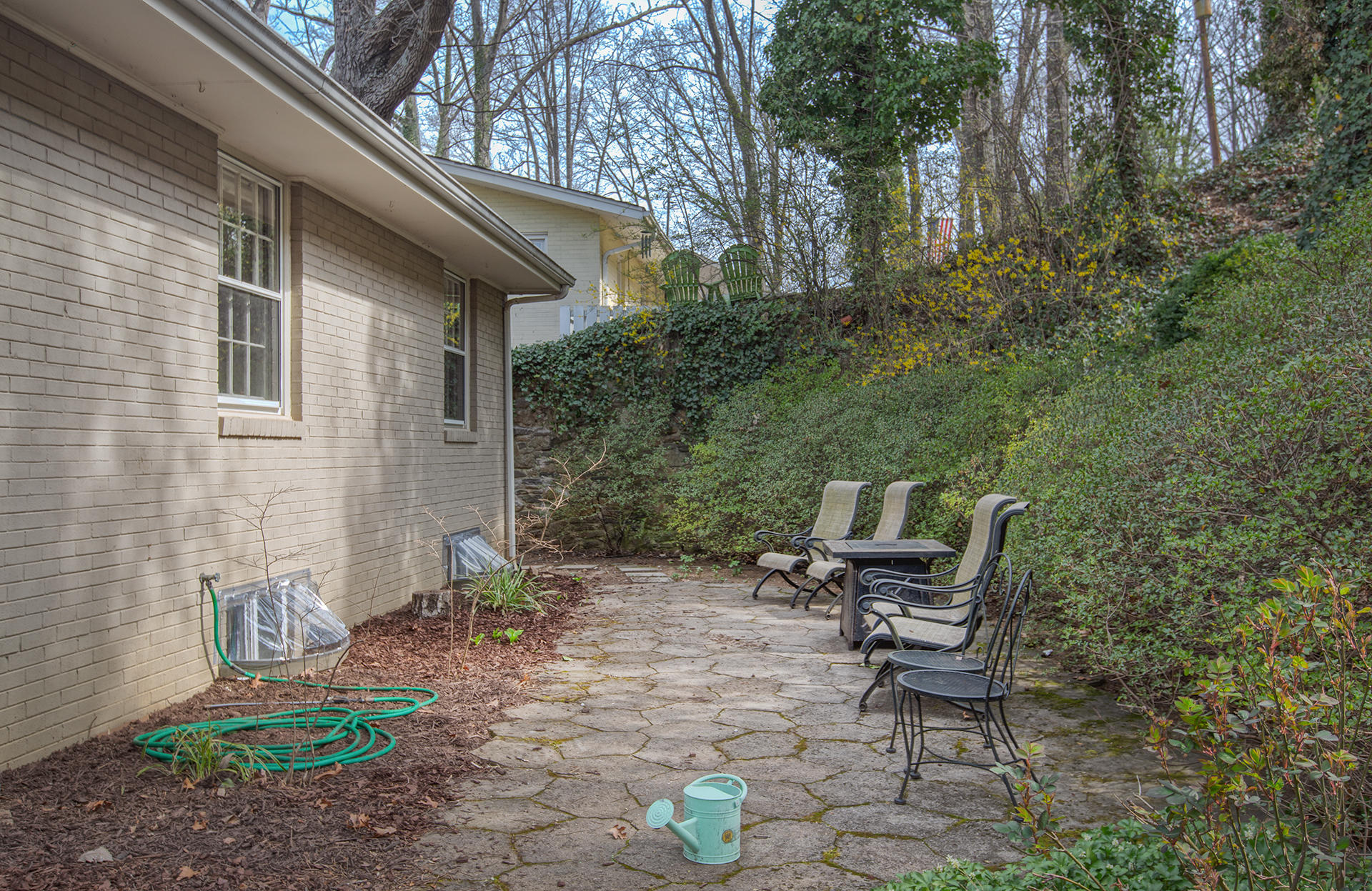 3120 Stoneridge Road Southwest Roanoke, VA 24014 - Photo 30 of 35 a view of chair and table in backyard of the house