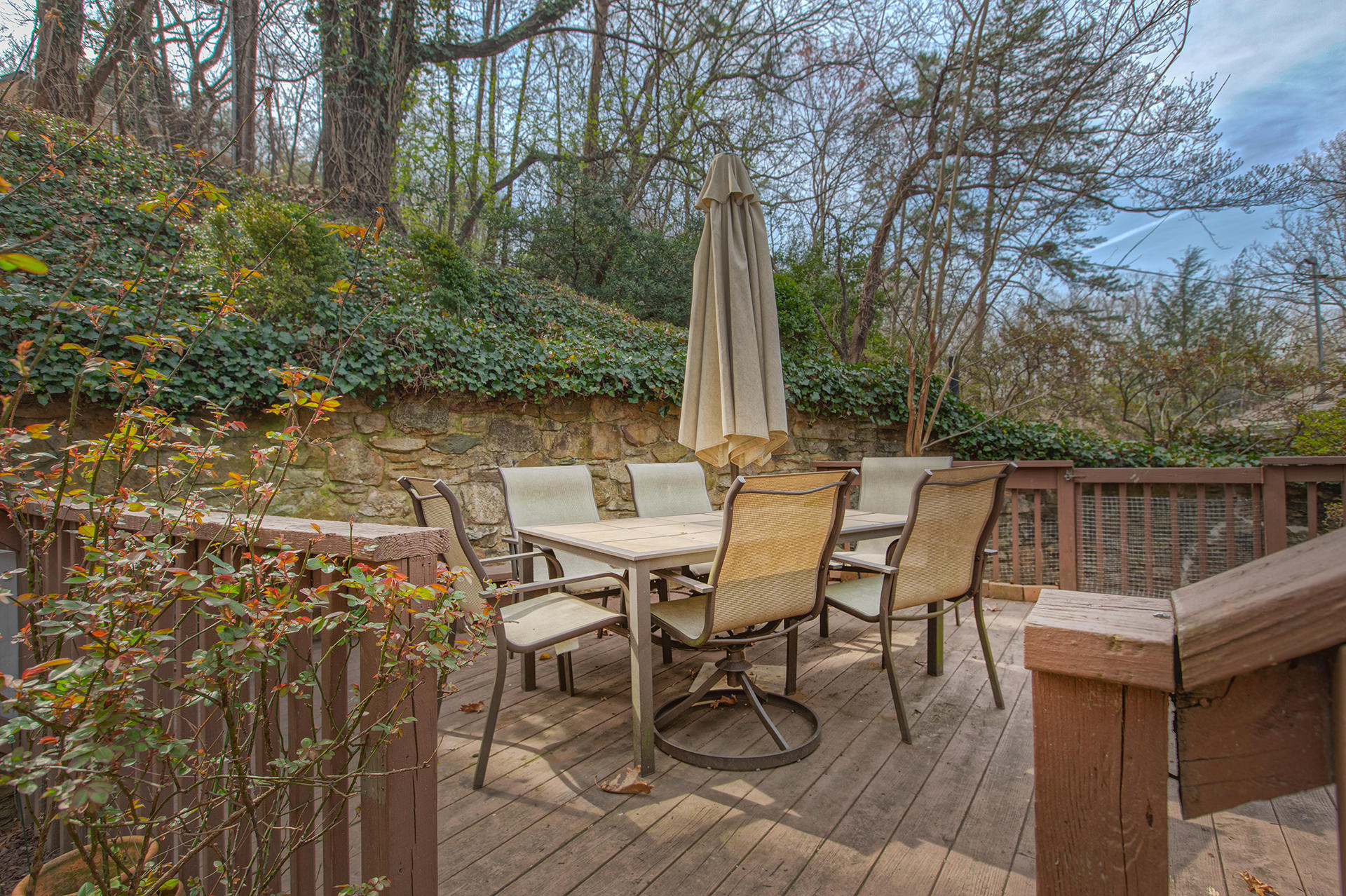 3120 Stoneridge Road Southwest Roanoke, VA 24014 - Photo 31 of 35 a view of a patio with table and chairs with wooden floor and fence