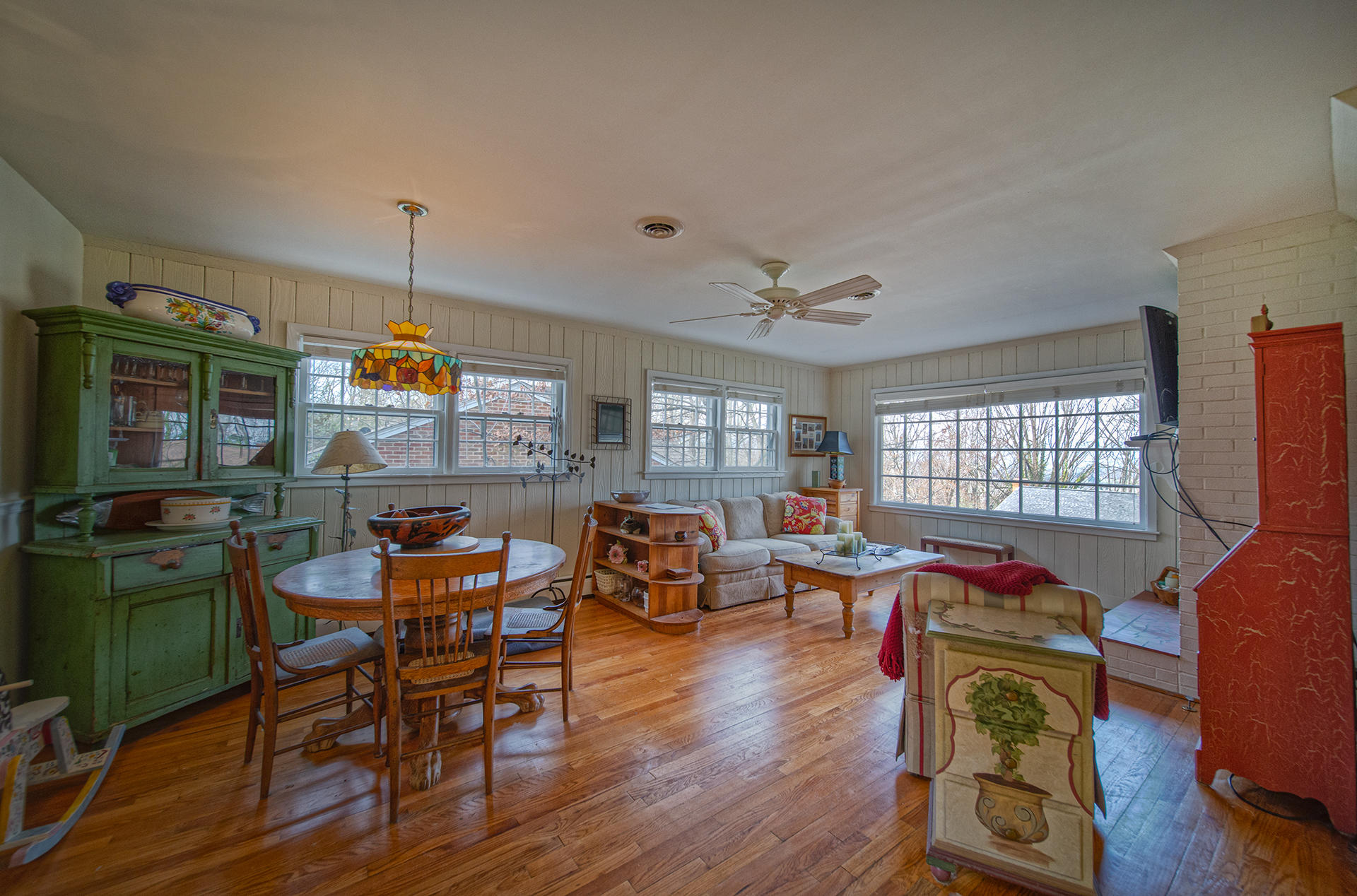 3120 Stoneridge Road Southwest Roanoke, VA 24014 - Photo 9 of 35 a view of a dining room with furniture window and wooden floor