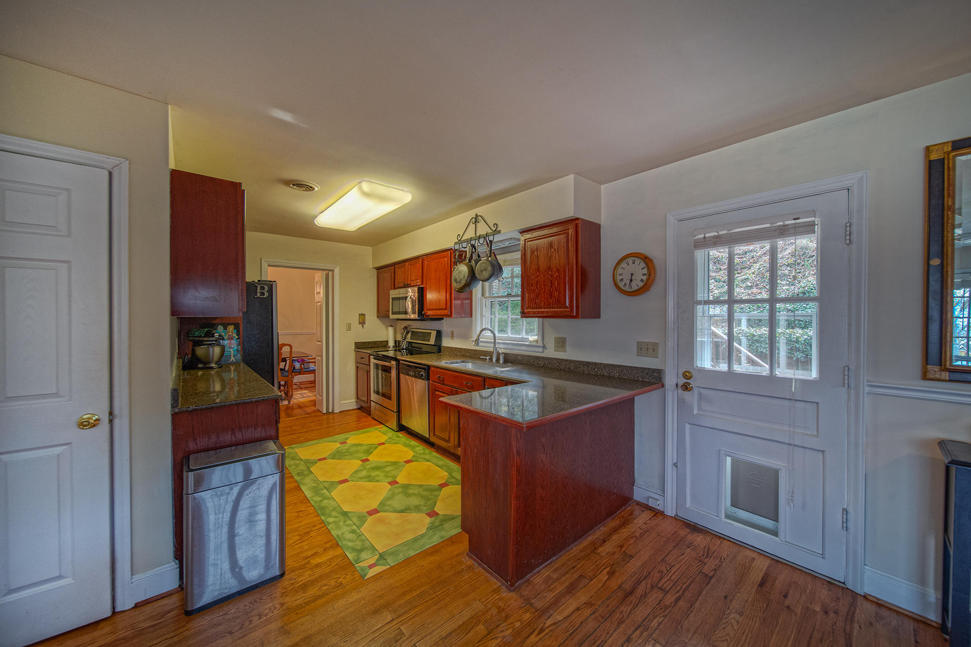 3120 Stoneridge Road Southwest Roanoke, VA 24014 - Photo 10 of 35 a kitchen with granite countertop wooden floors and wide window