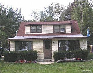 8213 Lakeshore Road Lexington, MI 48450 - Photo 1 of 1 Main House, front view