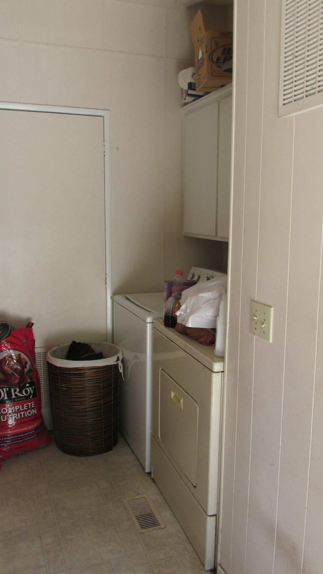 29405 Day Road McArthur, CA 96056 - Photo 22 of 45 a room with a wooden cabinets and washing machine