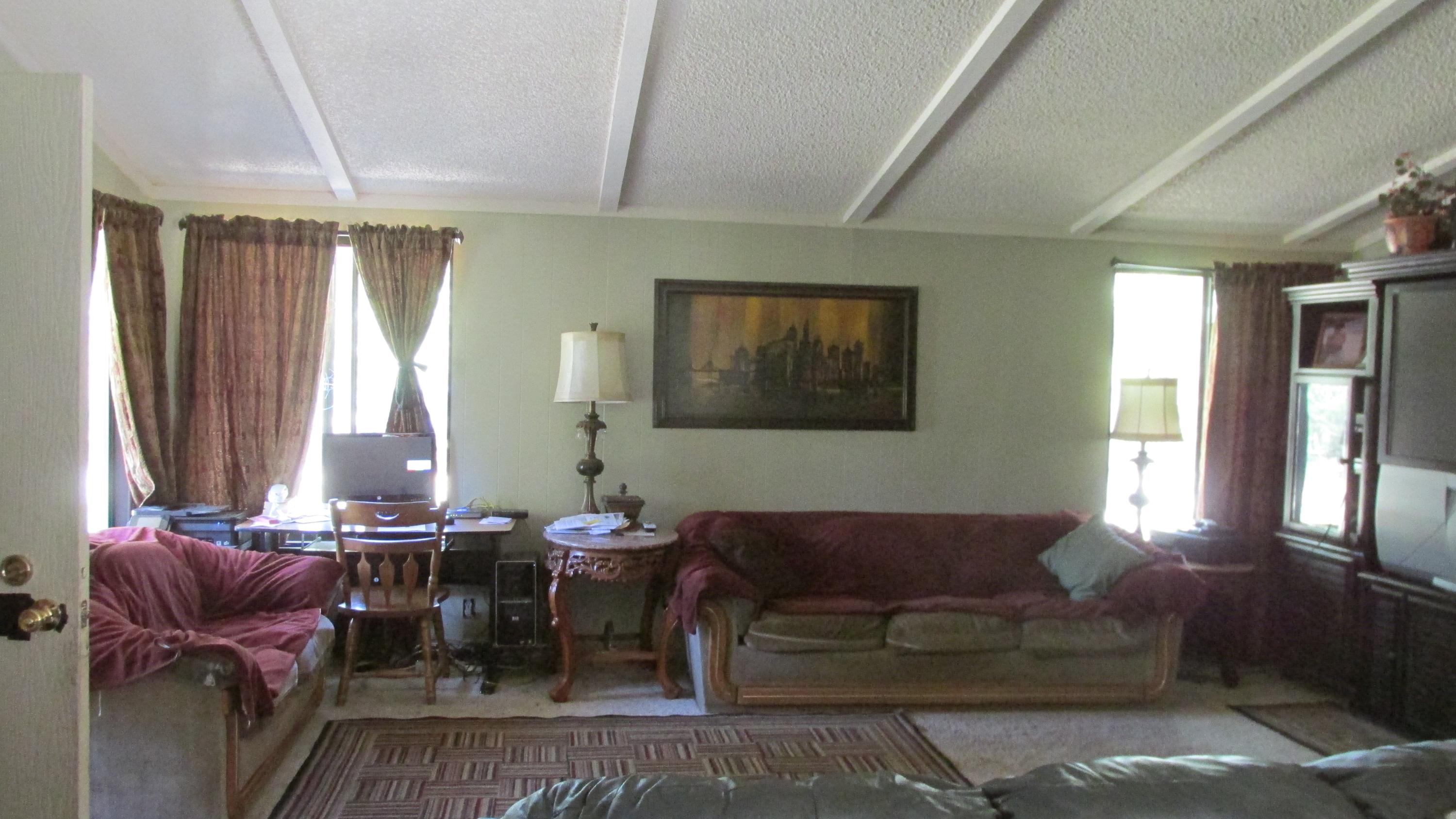 29405 Day Road McArthur, CA 96056 - Photo 4 of 45 a living room with furniture a large window and wooden floor