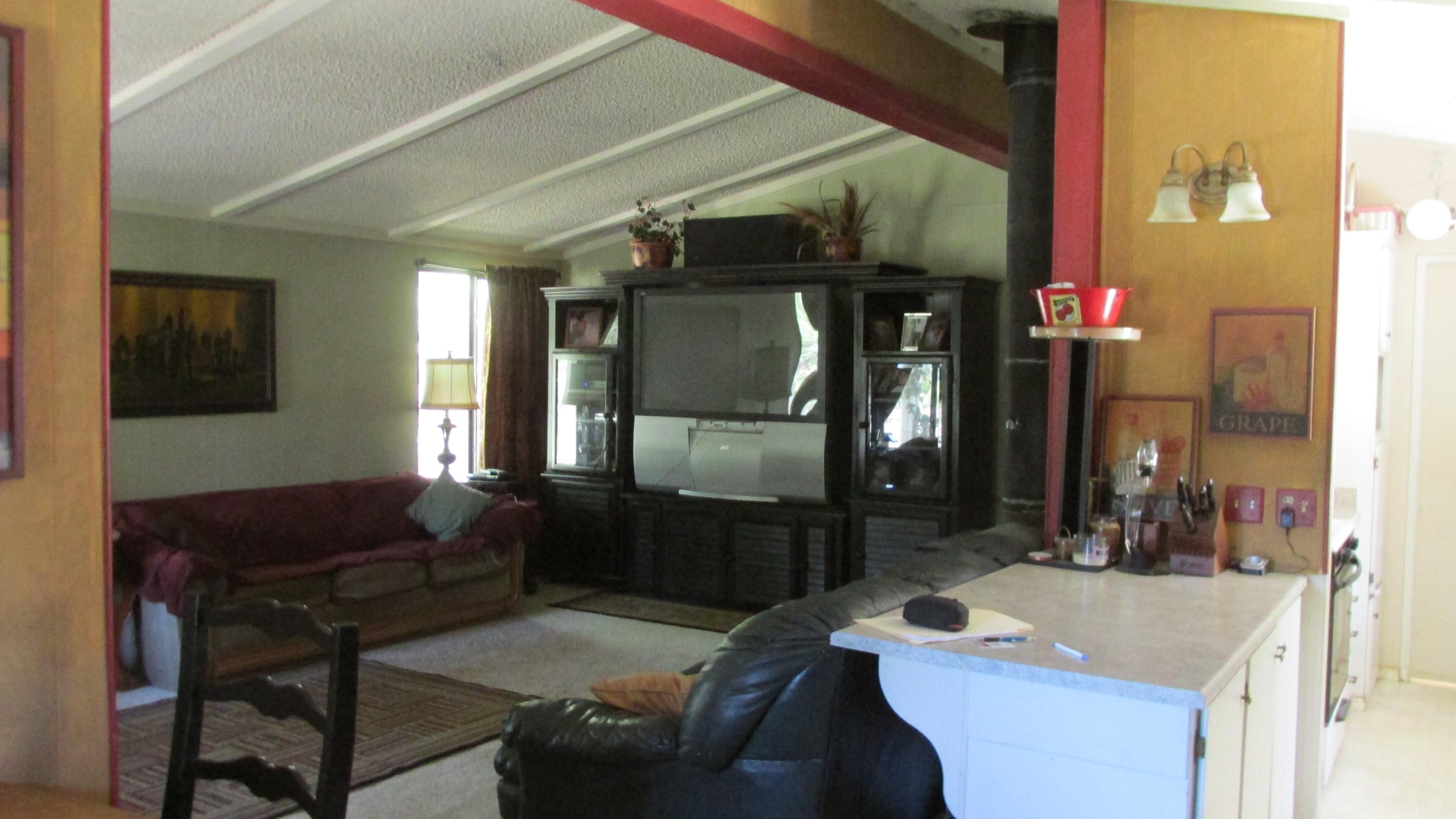 29405 Day Road McArthur, CA 96056 - Photo 45 of 45 a living room with furniture a flat screen tv and a table