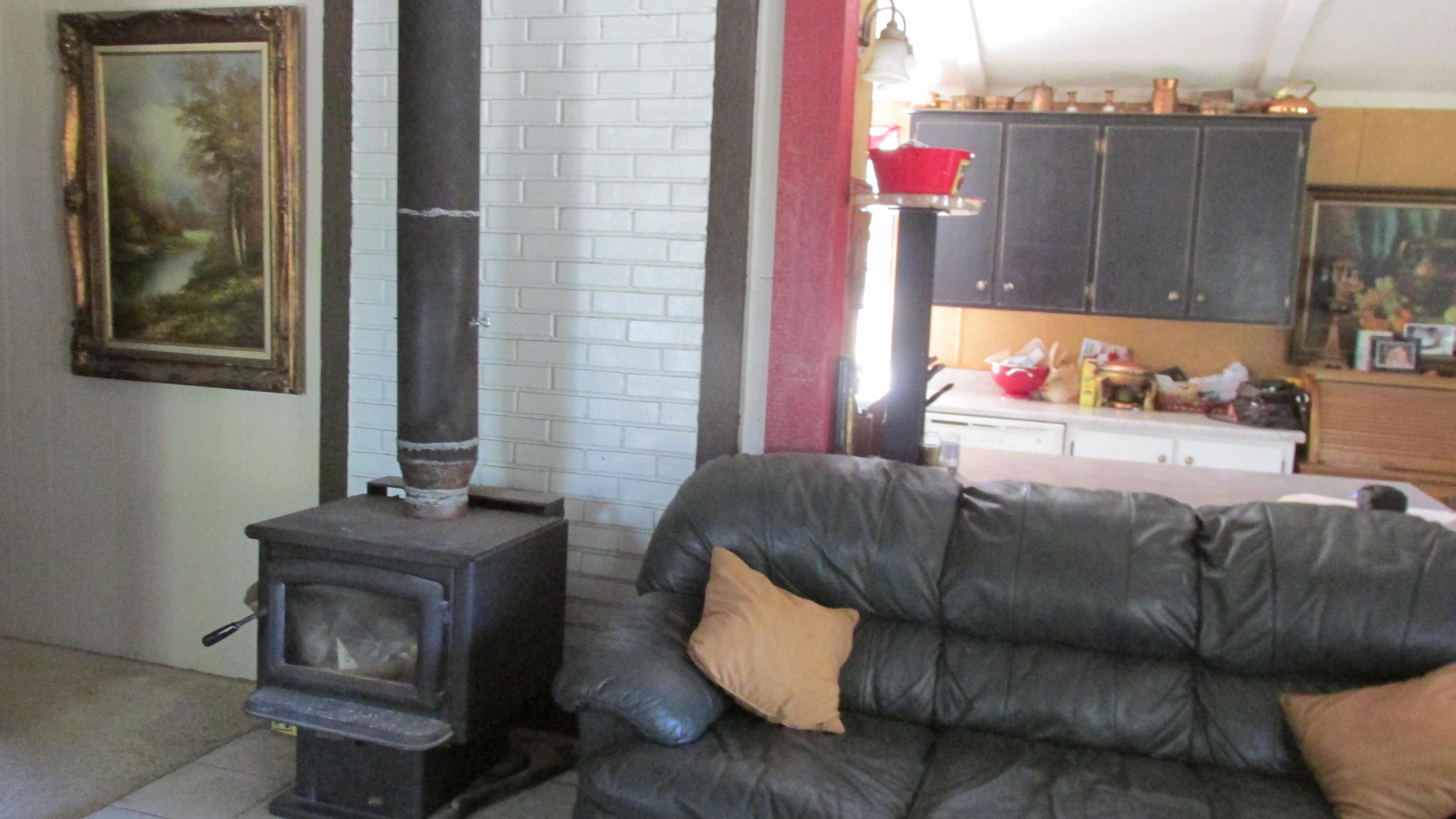 29405 Day Road McArthur, CA 96056 - Photo 5 of 45 a living room with furniture and a fireplace