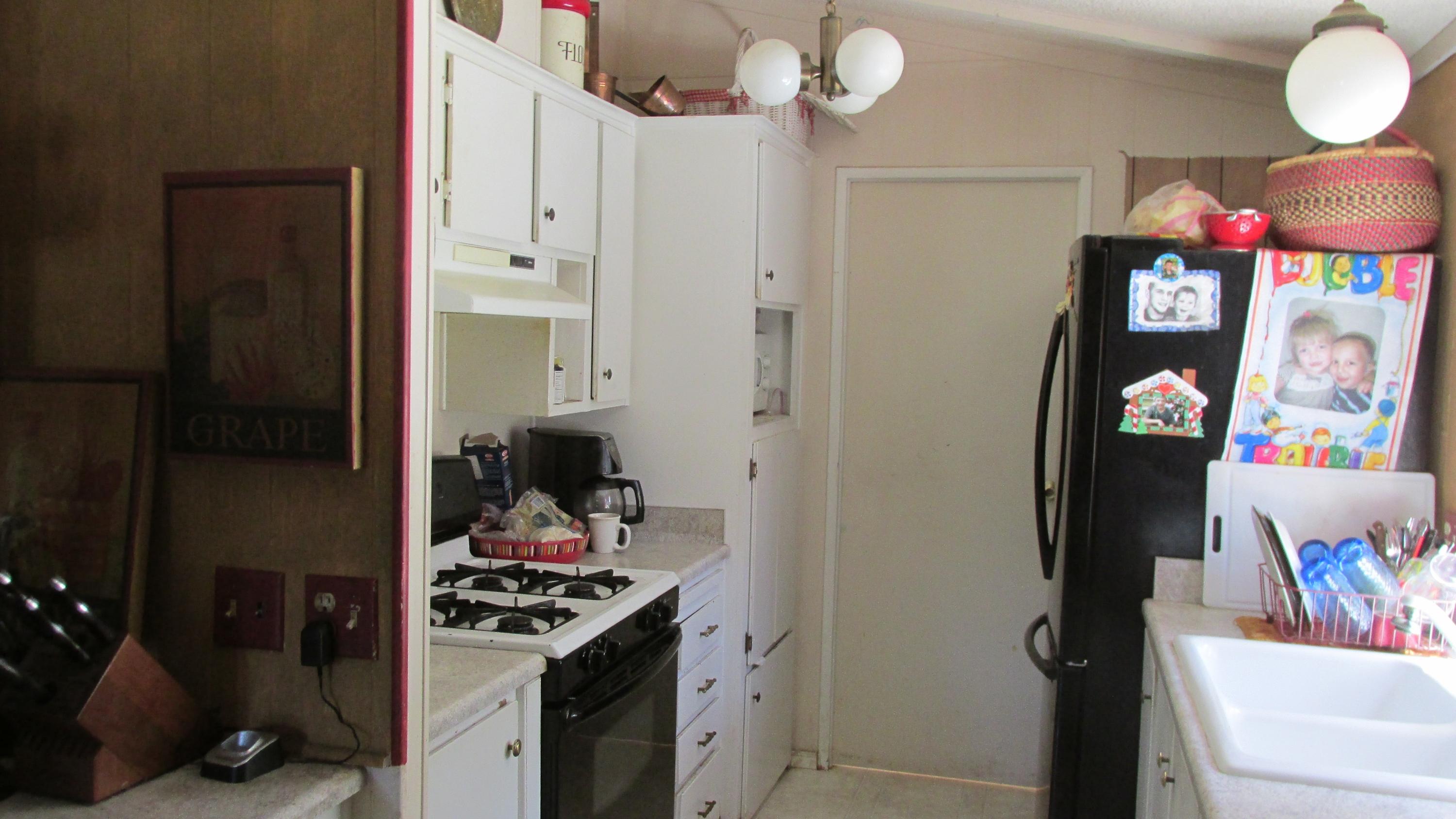 29405 Day Road McArthur, CA 96056 - Photo 9 of 45 a kitchen with stainless steel appliances granite countertop a stove and a refrigerator