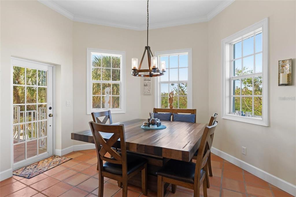 63 Palm Drive Placida, FL 33946 - Photo 13 of 54 a view of a dining room with furniture window and outside view