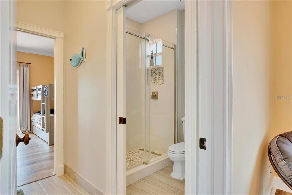 63 Palm Drive Placida, FL 33946 - Photo 24 of 54 a view of a bathroom from a hallway