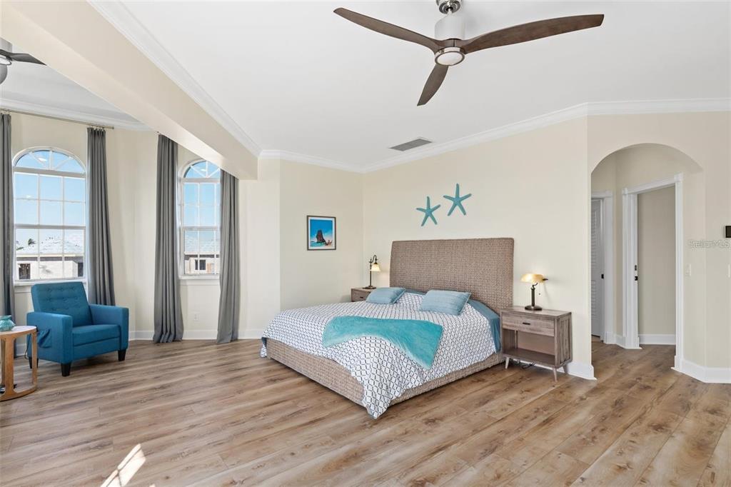 63 Palm Drive Placida, FL 33946 - Photo 30 of 54 a bedroom with a bed and wooden floor