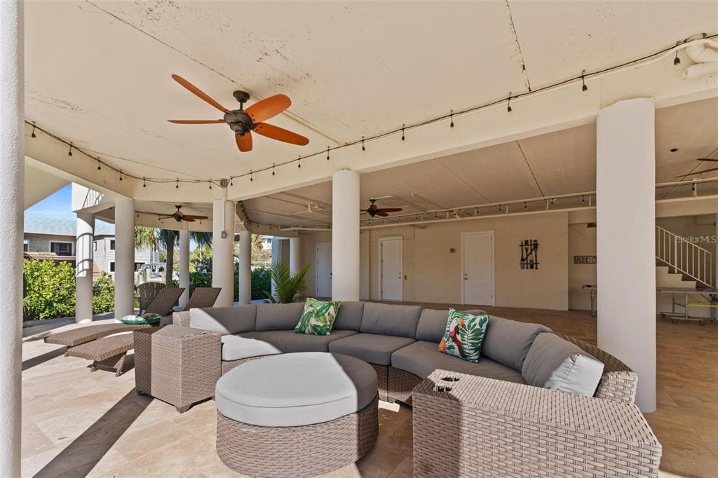 63 Palm Drive Placida, FL 33946 - Photo 45 of 54 a living room with furniture and a chandelier