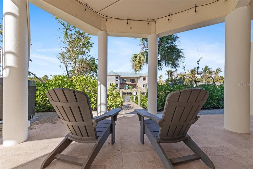 63 Palm Drive Placida, FL 33946 - Photo 46 of 54 a view of a chairs and table in patio