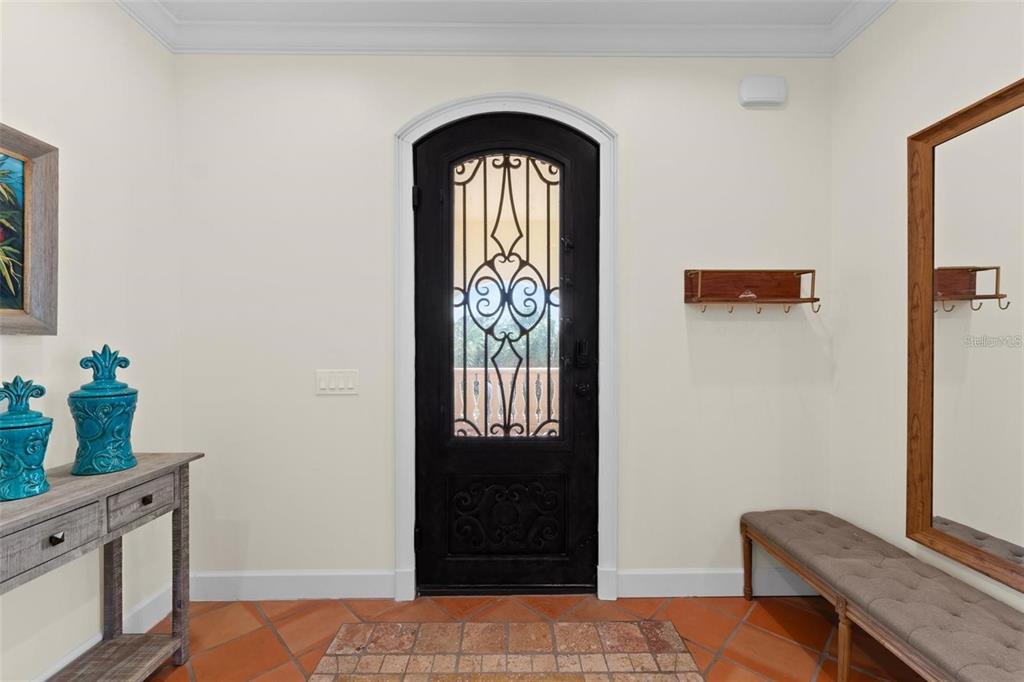 63 Palm Drive Placida, FL 33946 - Photo 6 of 54 a bedroom with a bed and a potted plant