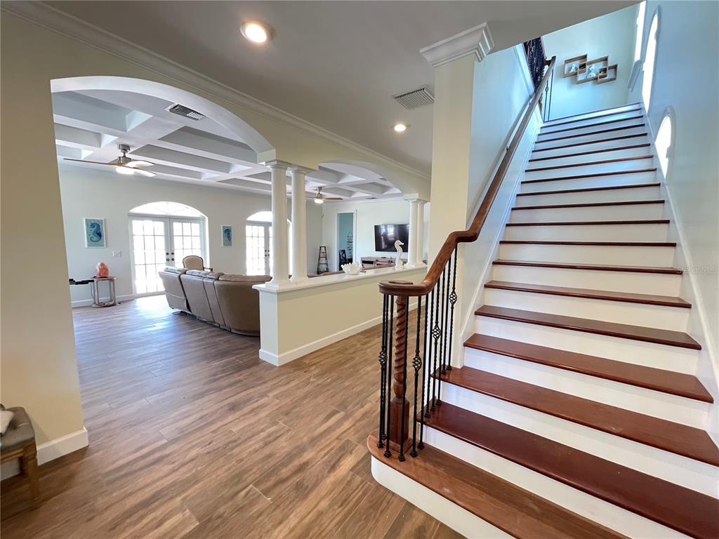 63 Palm Drive Placida, FL 33946 - Photo 8 of 54 a view of a hallway with wooden floor and stairs