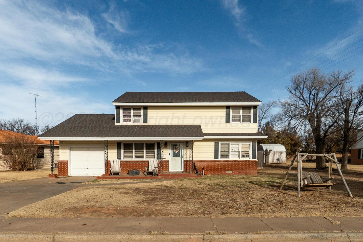 11 Travis Circle Tulia, TX 79088 - Photo 1 of 21 a front view of a house with a yard