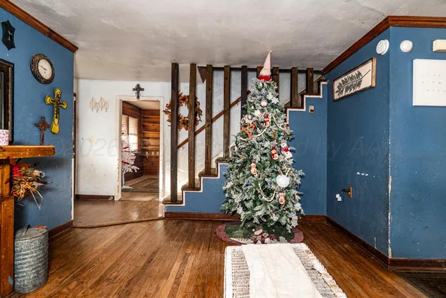 a view of entryway with stairs and wooden floor