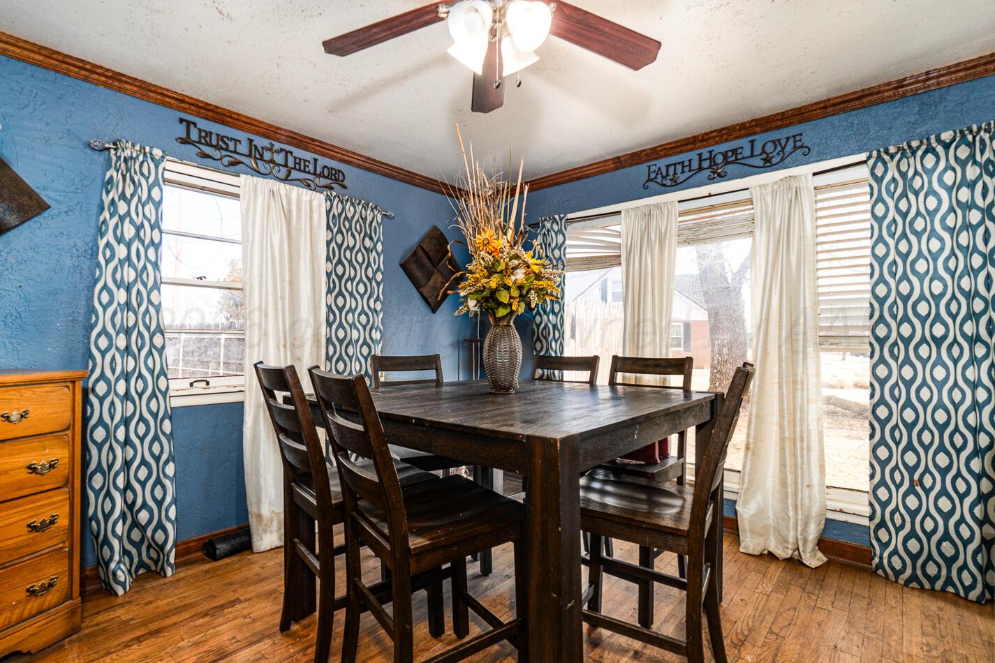 11 Travis Circle Tulia, TX 79088 - Photo 6 of 21 a view of a dining room with furniture window and wooden floor