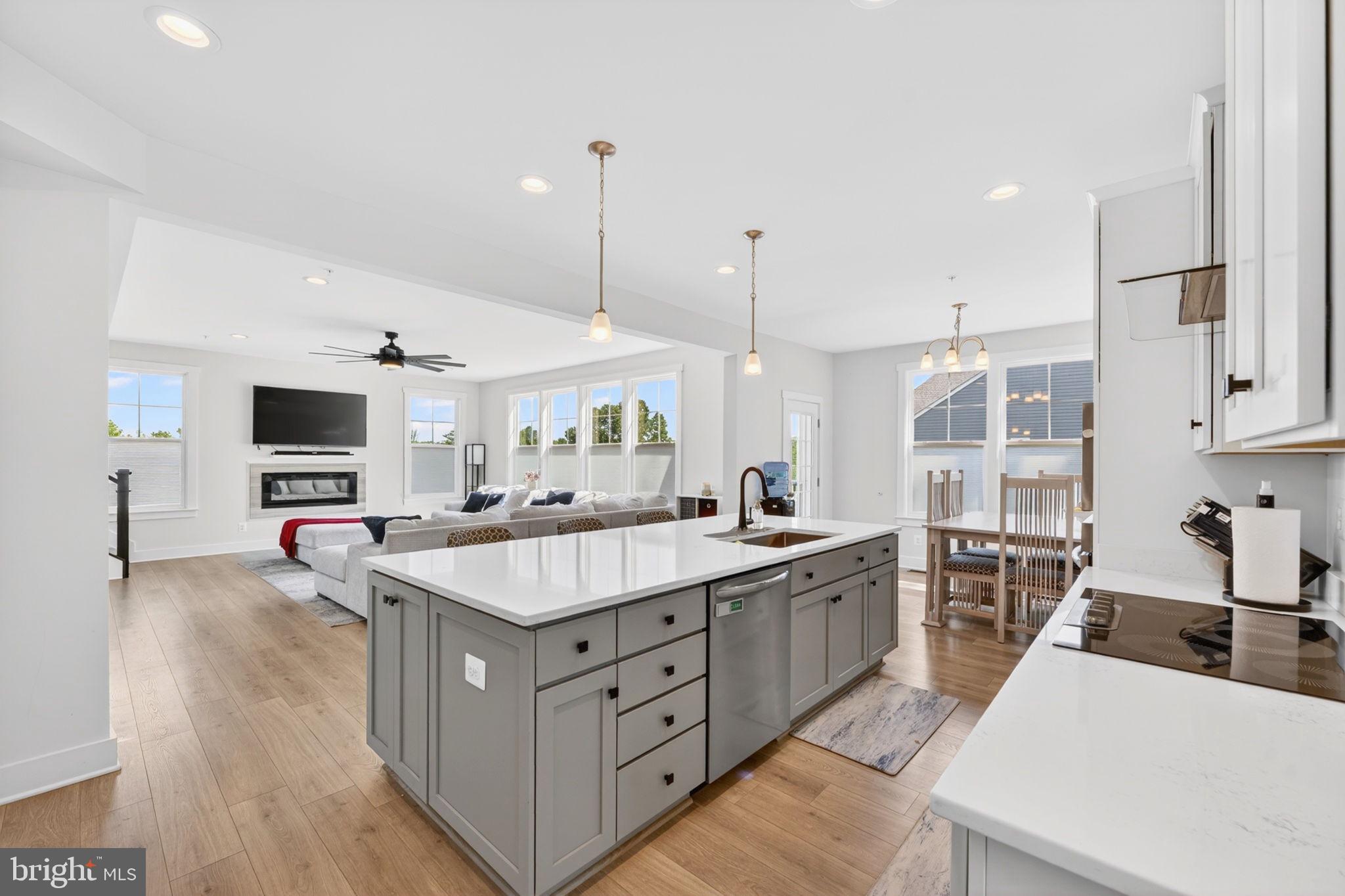 30 Range Road North East, MD 21901 - Photo 23 of 73 a large kitchen with stainless steel appliances a stove a sink a oven a table and chairs