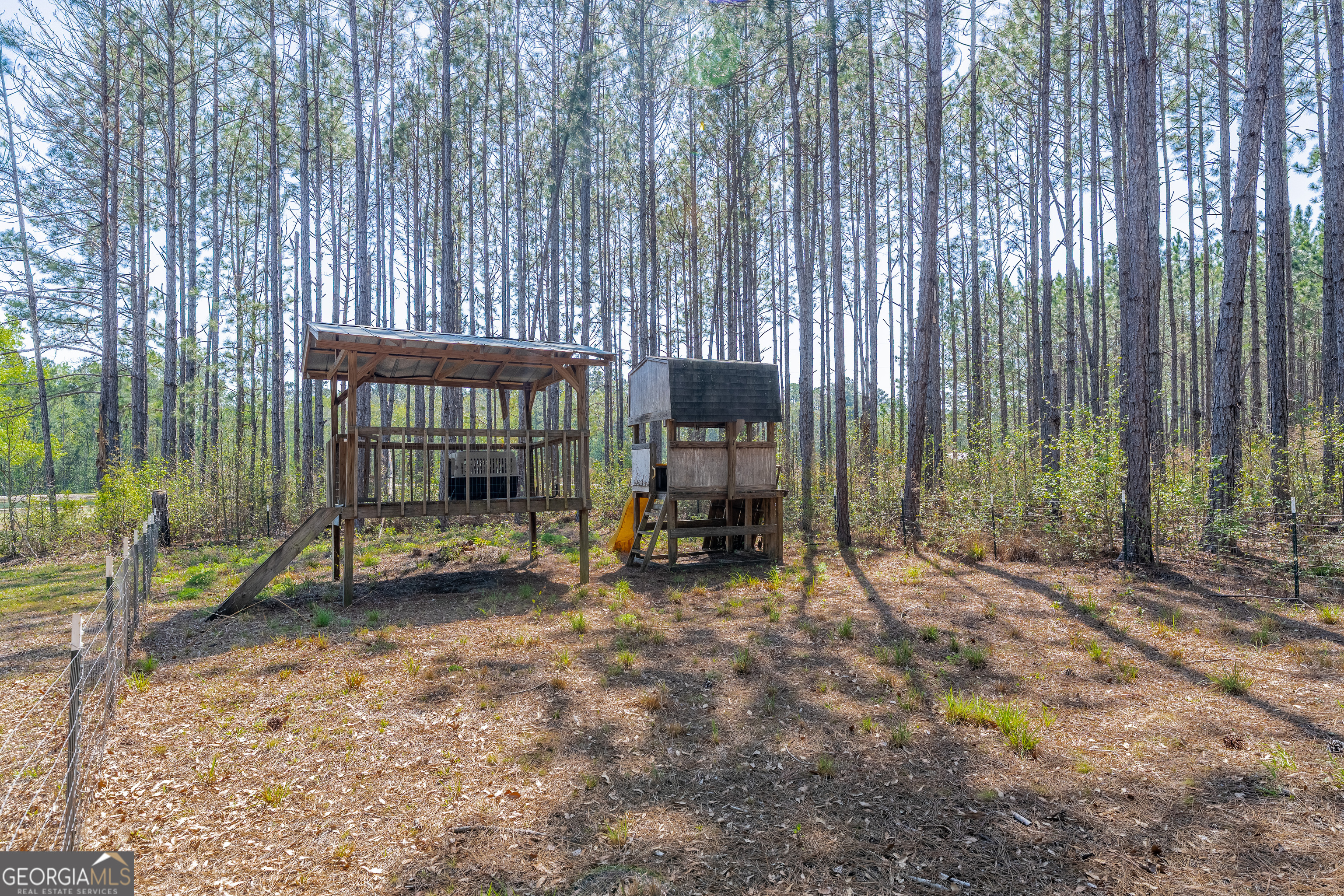3642 Tanner Lane Waycross, GA 31503 - Photo 12 of 36 a view of a backyard with table and chairs