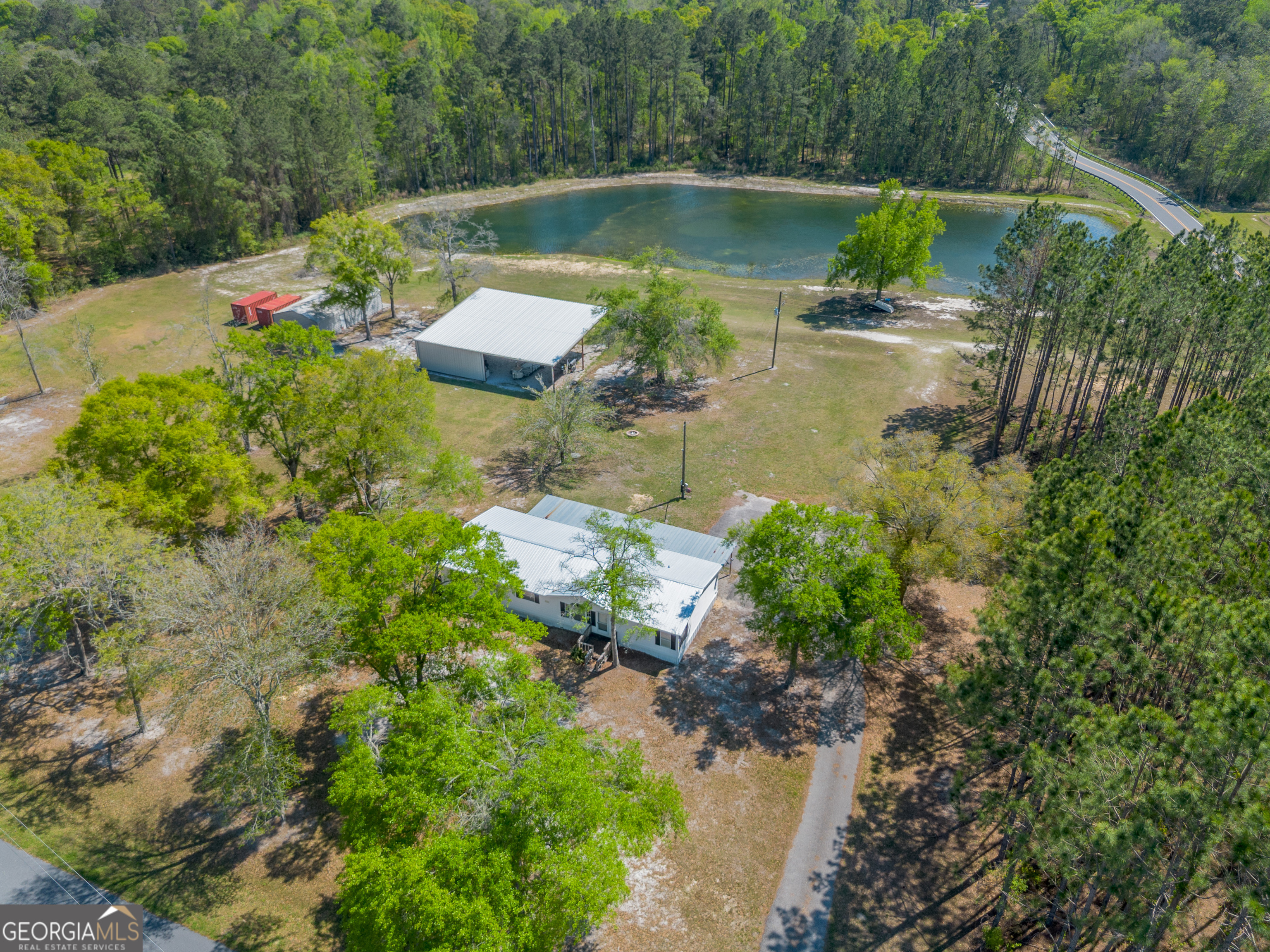 3642 Tanner Lane Waycross, GA 31503 - Photo 20 of 36 a view of a lake with a house