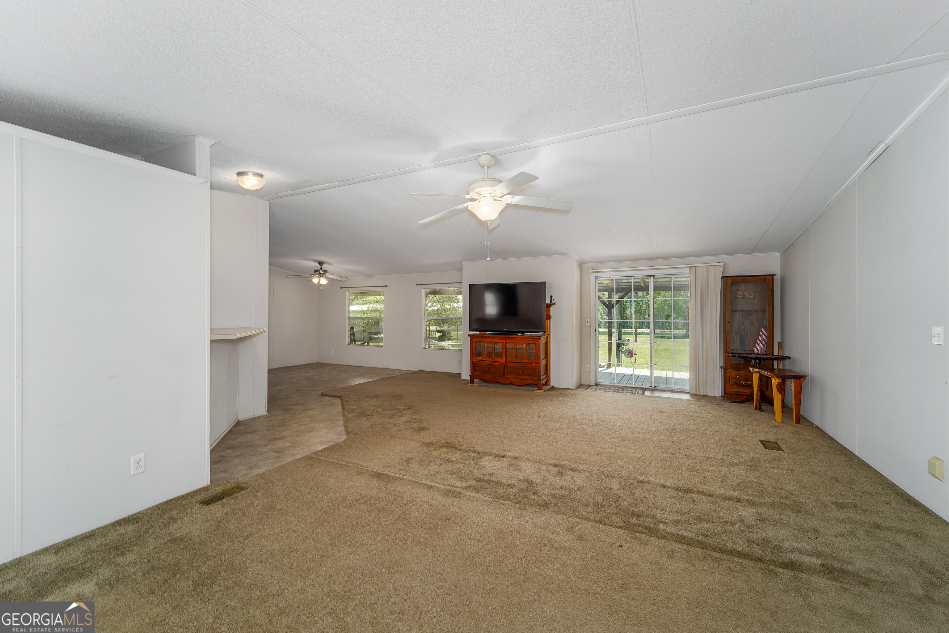 3642 Tanner Lane Waycross, GA 31503 - Photo 22 of 36 a view of a livingroom with a furniture and a window