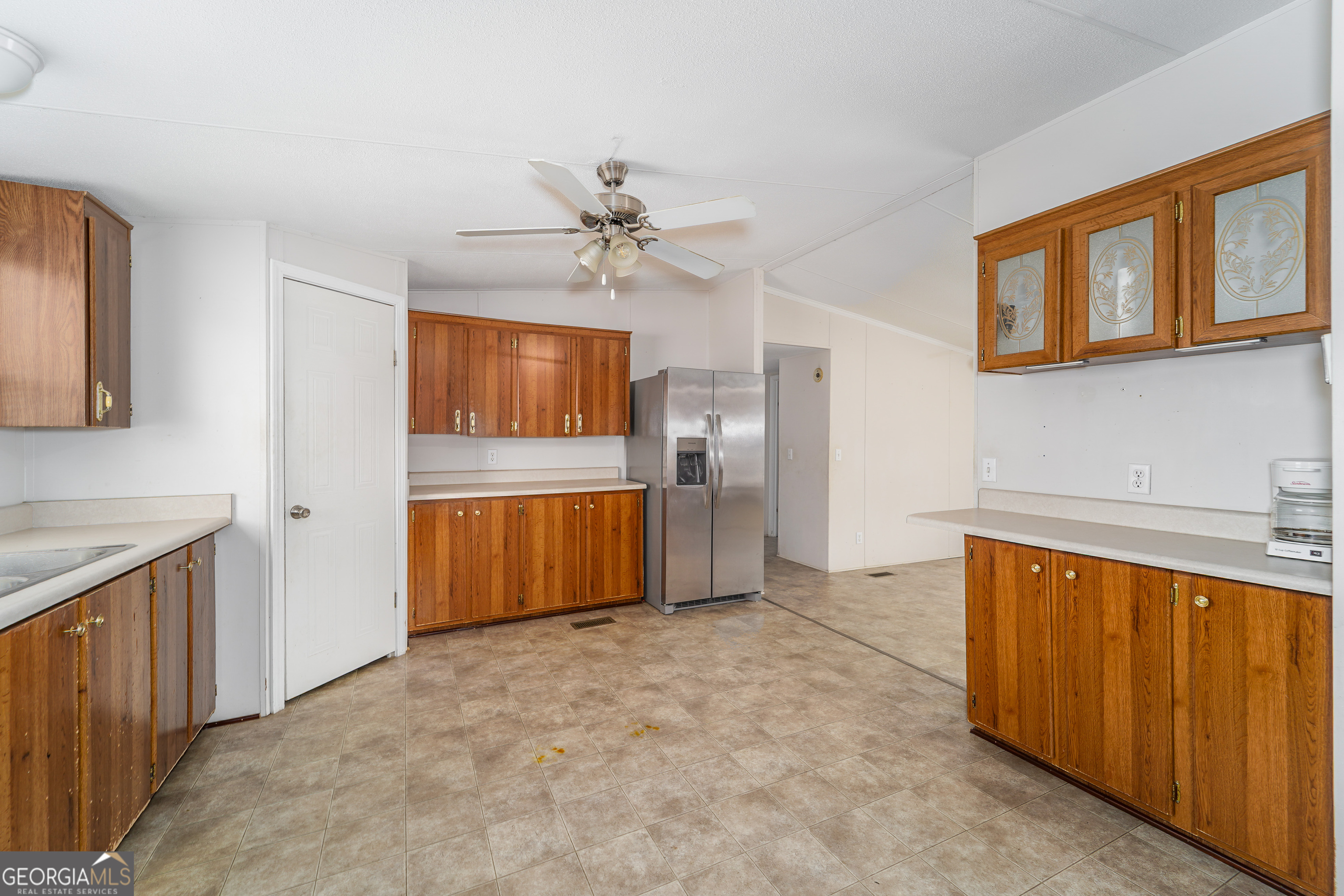 3642 Tanner Lane Waycross, GA 31503 - Photo 27 of 36 a view of a kitchen with a sink and cabinet
