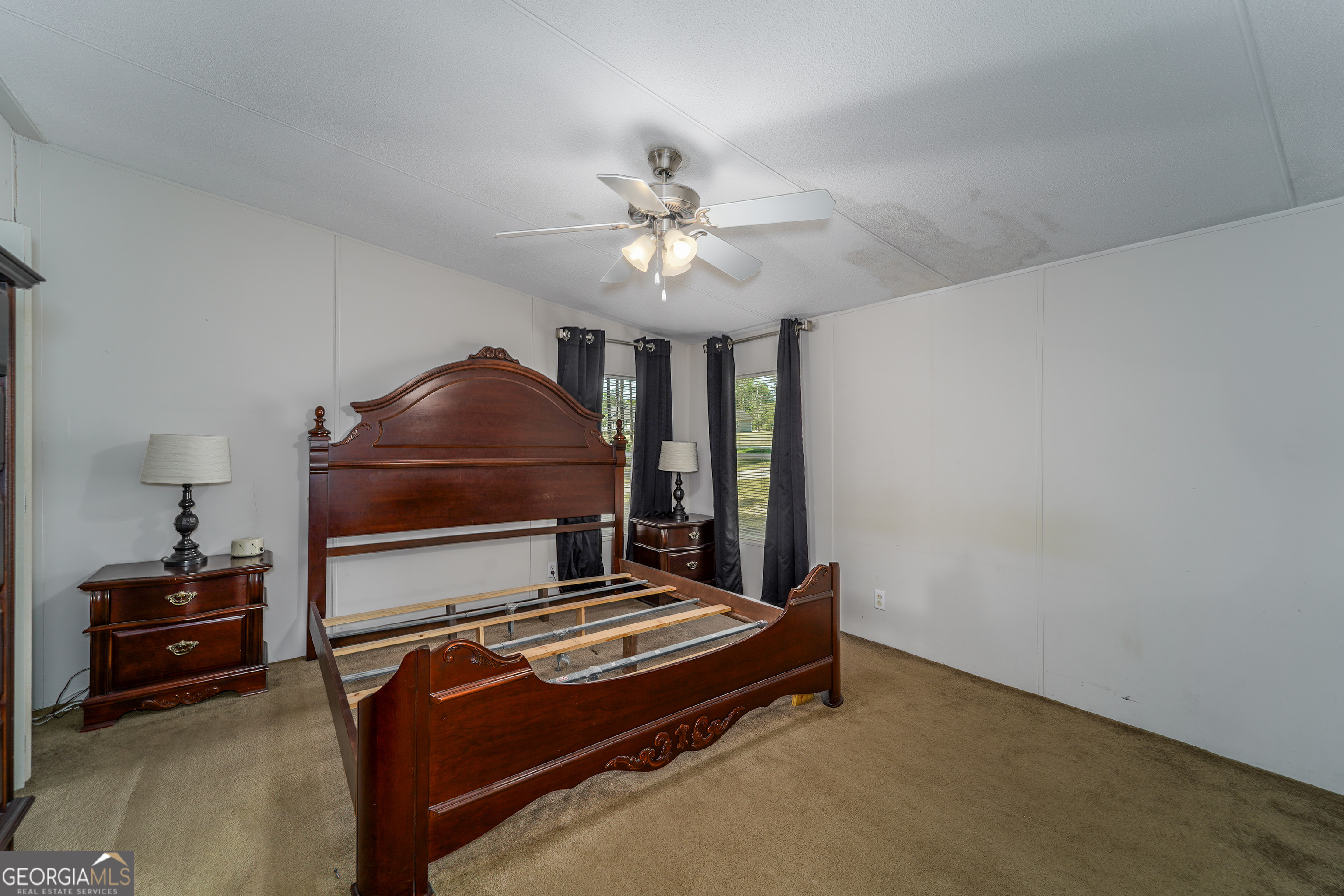 3642 Tanner Lane Waycross, GA 31503 - Photo 28 of 36 a bedroom with a bed and a chandelier