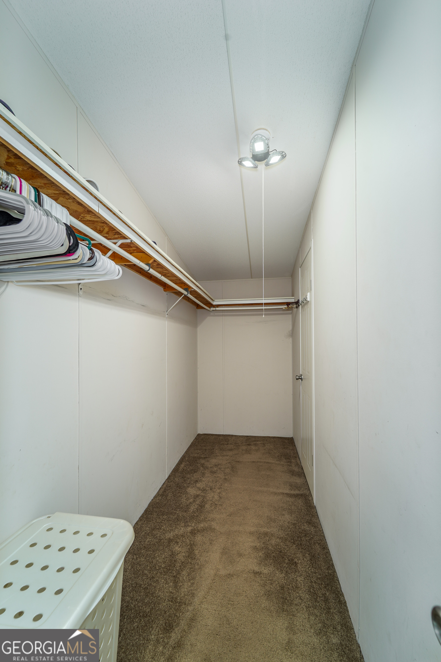 3642 Tanner Lane Waycross, GA 31503 - Photo 30 of 36 wooden floor in a hall with a chandelier