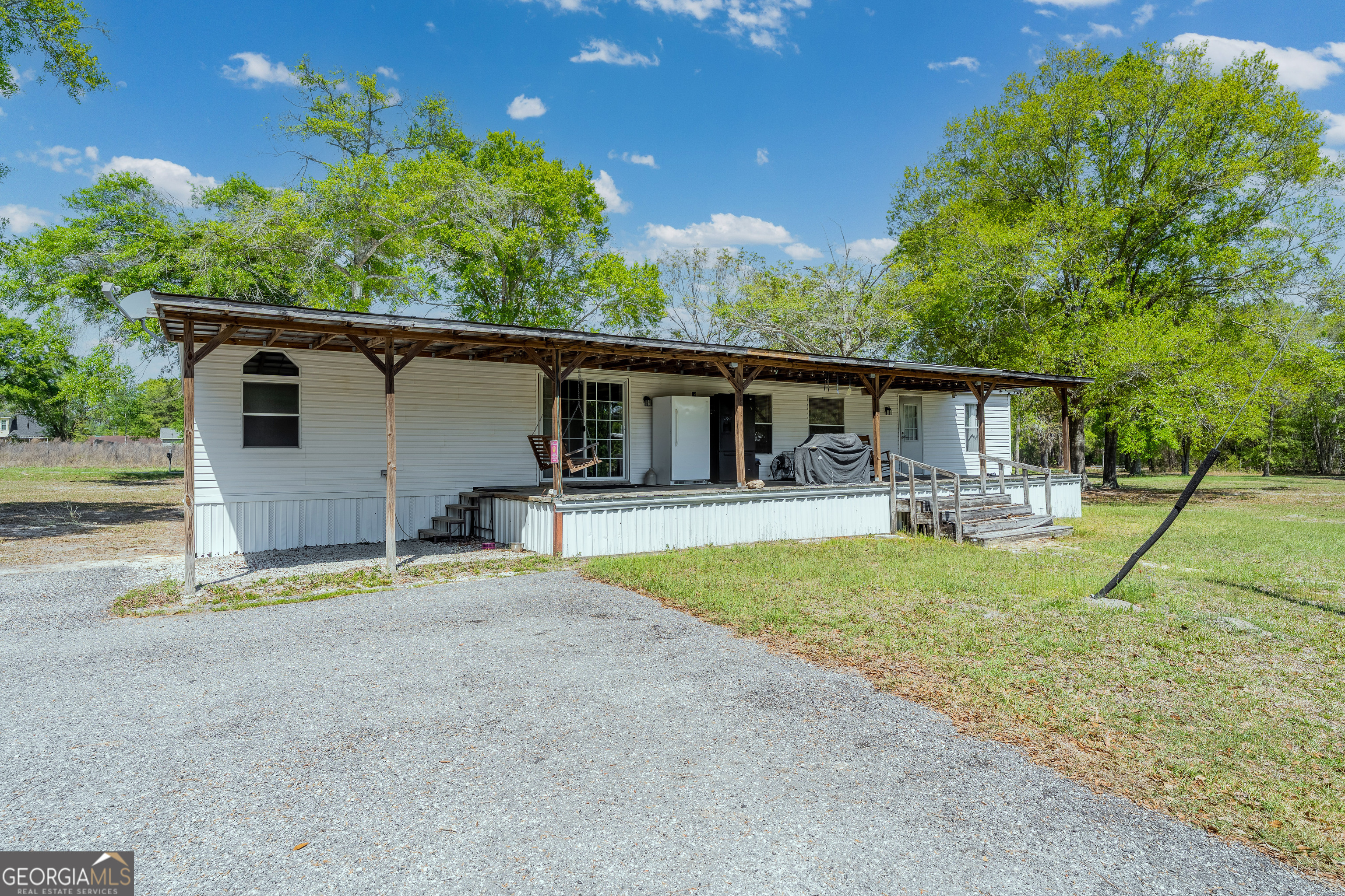 3642 Tanner Lane Waycross, GA 31503 - Photo 3 of 36 a house view with a backyard space