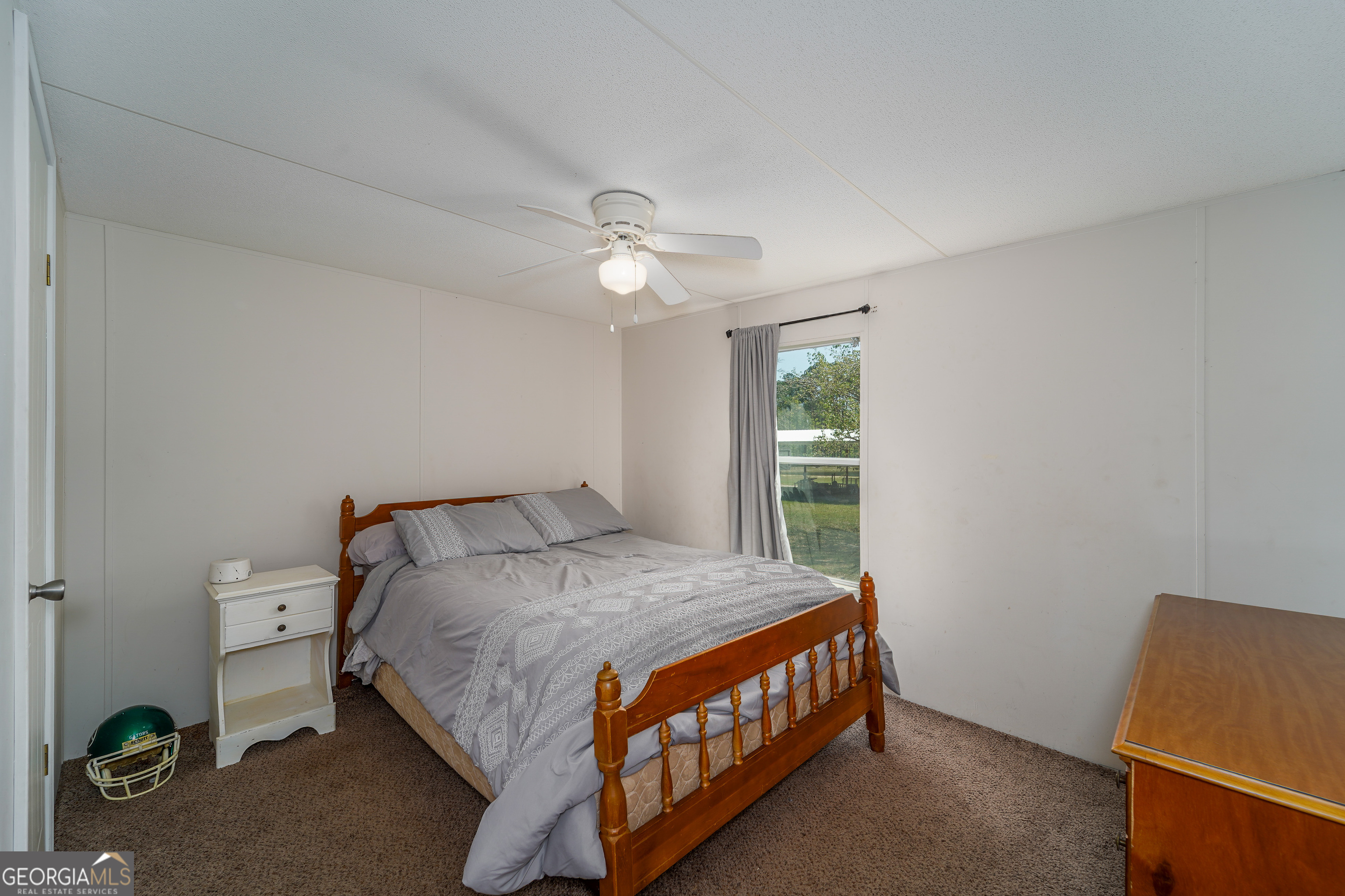 3642 Tanner Lane Waycross, GA 31503 - Photo 34 of 36 a bedroom with a bed and a window