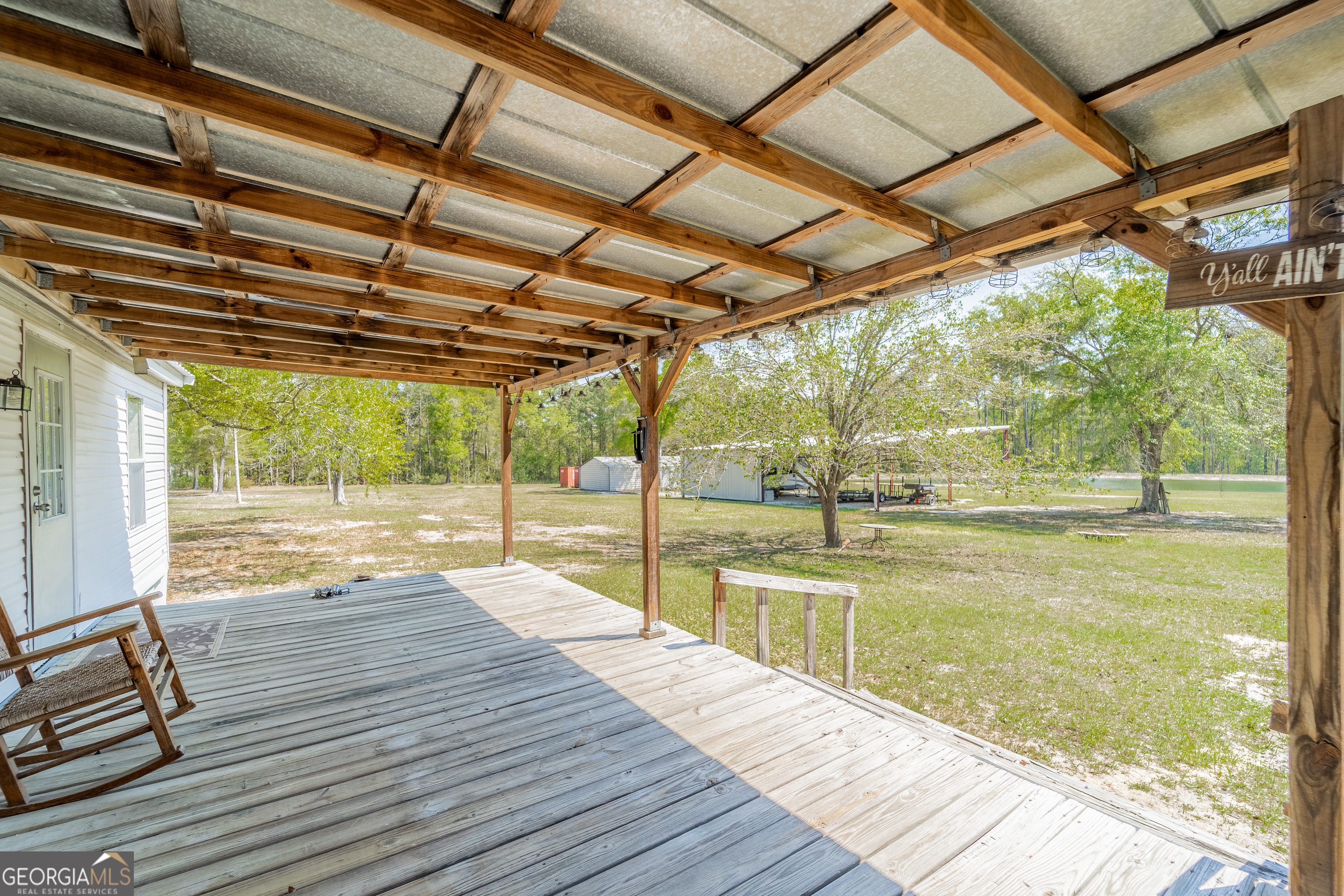 3642 Tanner Lane Waycross, GA 31503 - Photo 4 of 36 a view of swimming pool with wooden deck