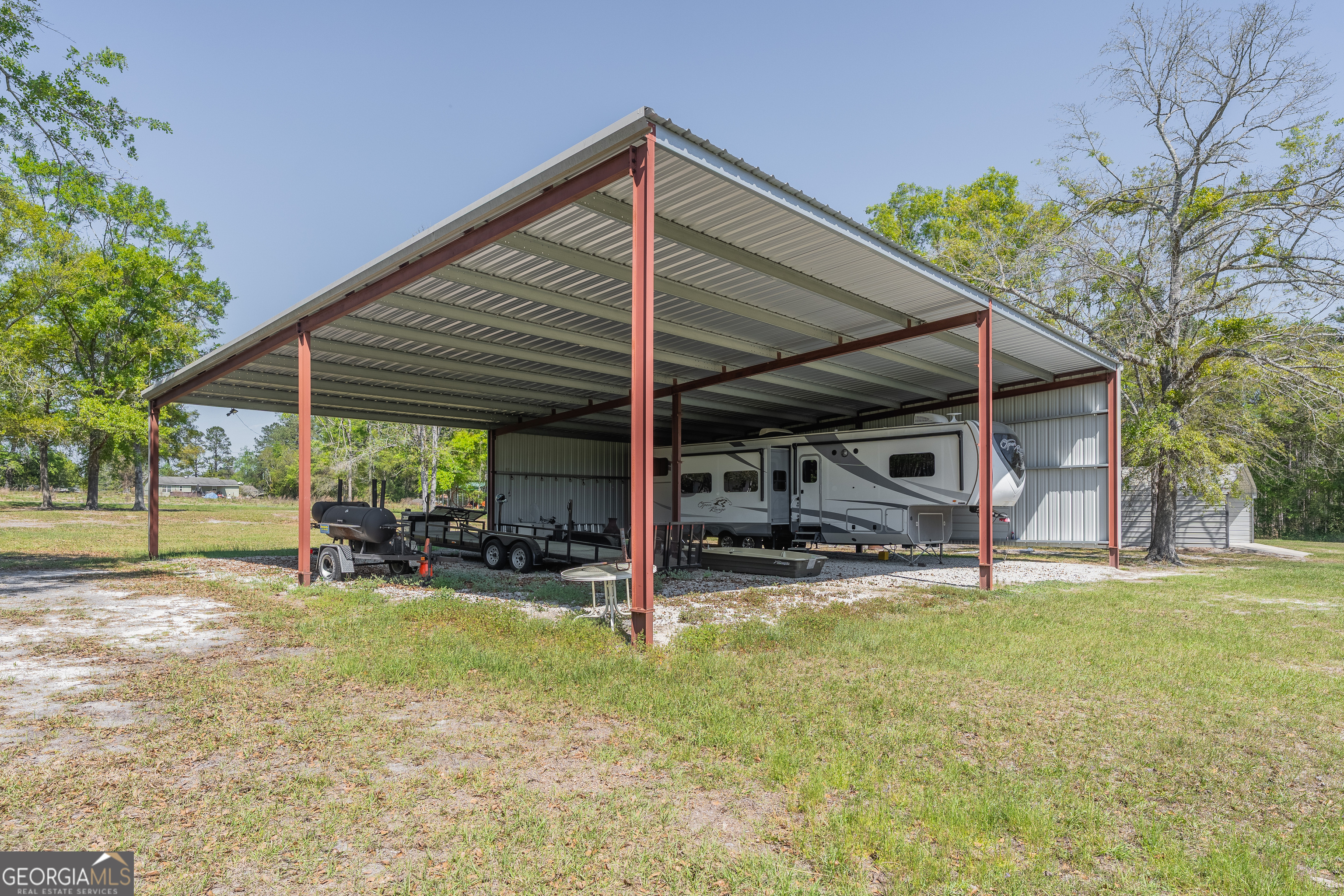 3642 Tanner Lane Waycross, GA 31503 - Photo 5 of 36 a view of a house with a yard patio and furniture