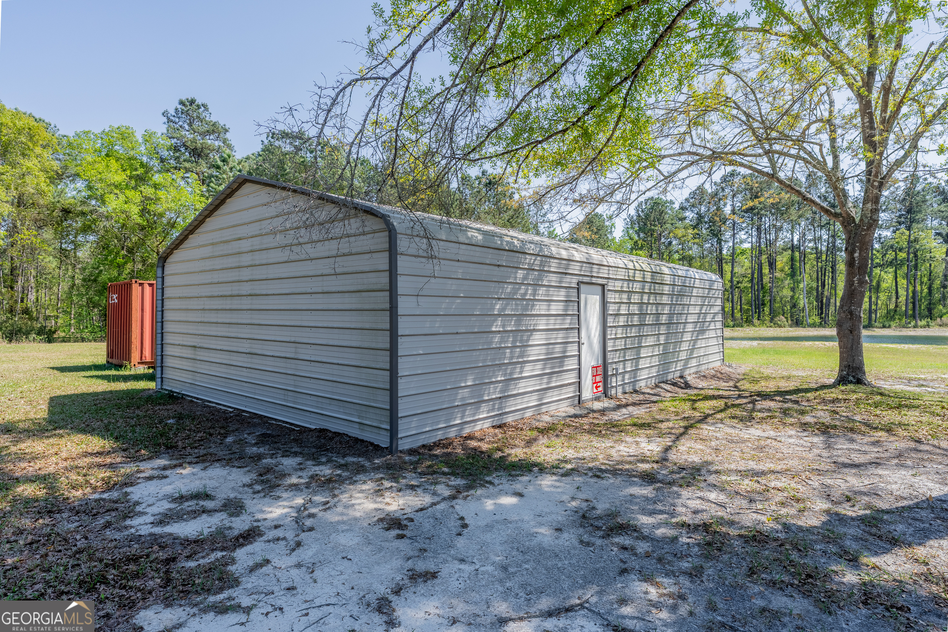 3642 Tanner Lane Waycross, GA 31503 - Photo 7 of 36 a view of a house with a yard and tree s