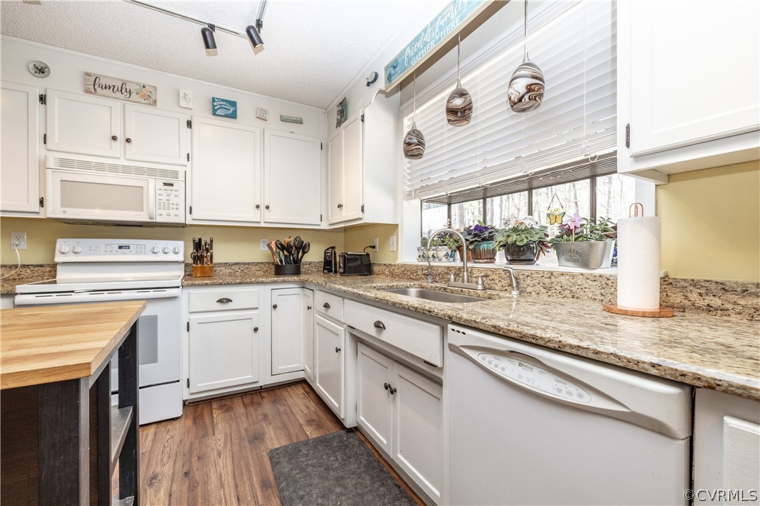 18920 Duval Road Moseley, VA 23120 - Photo 11 of 31 a kitchen with granite countertop white cabinets and white appliances