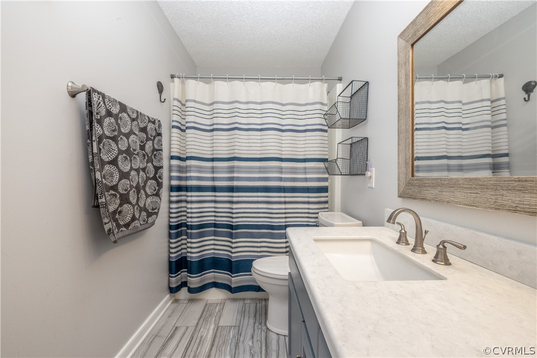 18920 Duval Road Moseley, VA 23120 - Photo 20 of 31 a bathroom with a sink a mirror and a shower