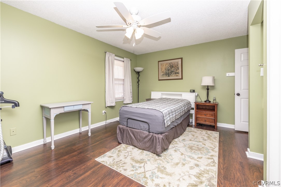 18920 Duval Road Moseley, VA 23120 - Photo 21 of 31 a spacious bedroom with a bed and a fireplace