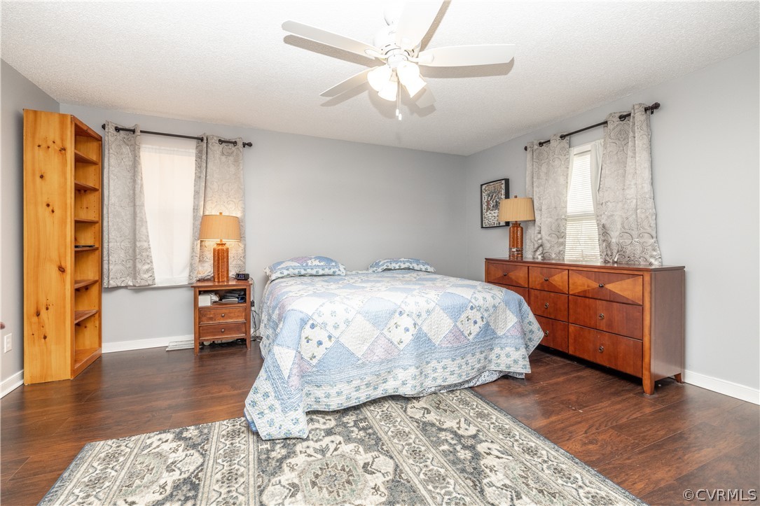 18920 Duval Road Moseley, VA 23120 - Photo 22 of 31 a bedroom with a large bed and a wooden floor