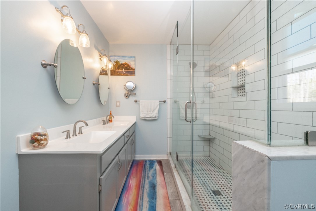 18920 Duval Road Moseley, VA 23120 - Photo 23 of 31 a bathroom with a sink and mirror