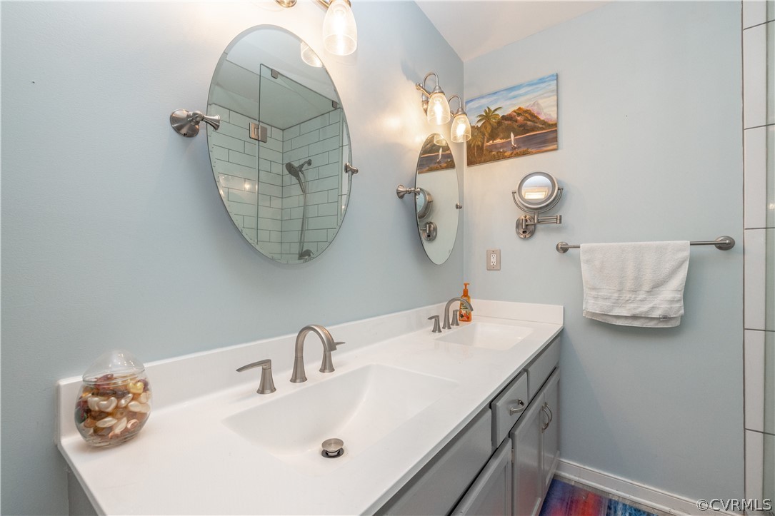 18920 Duval Road Moseley, VA 23120 - Photo 25 of 31 a bathroom with a sink and mirror