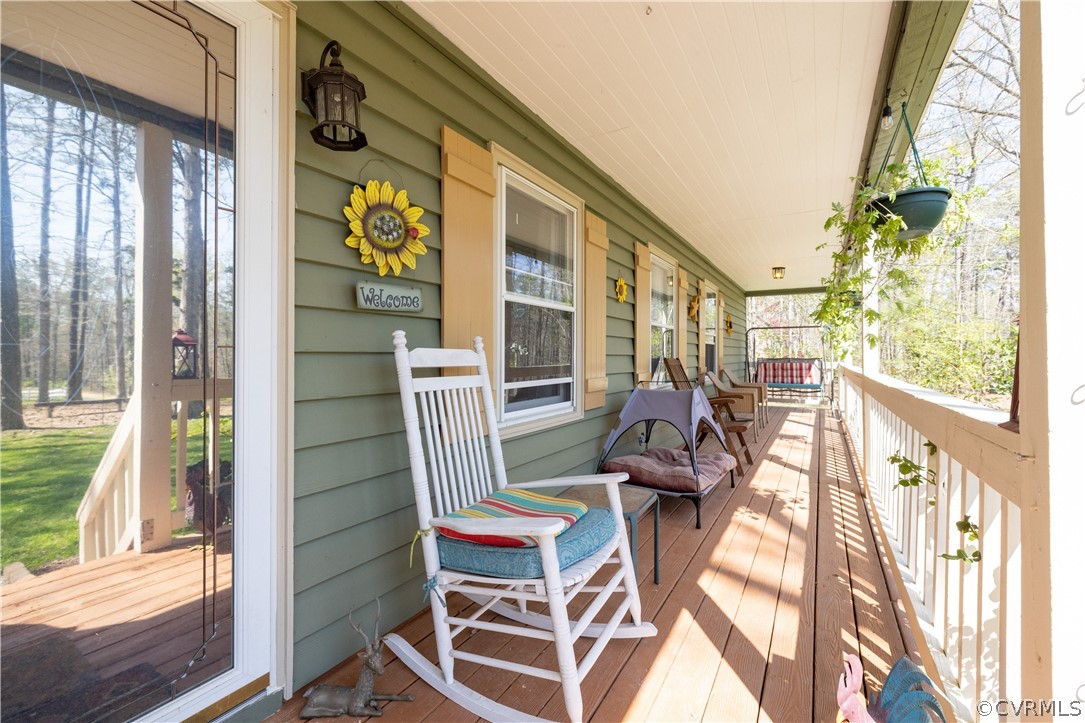 18920 Duval Road Moseley, VA 23120 - Photo 3 of 31 a view of balcony with two chairs and a potted plant