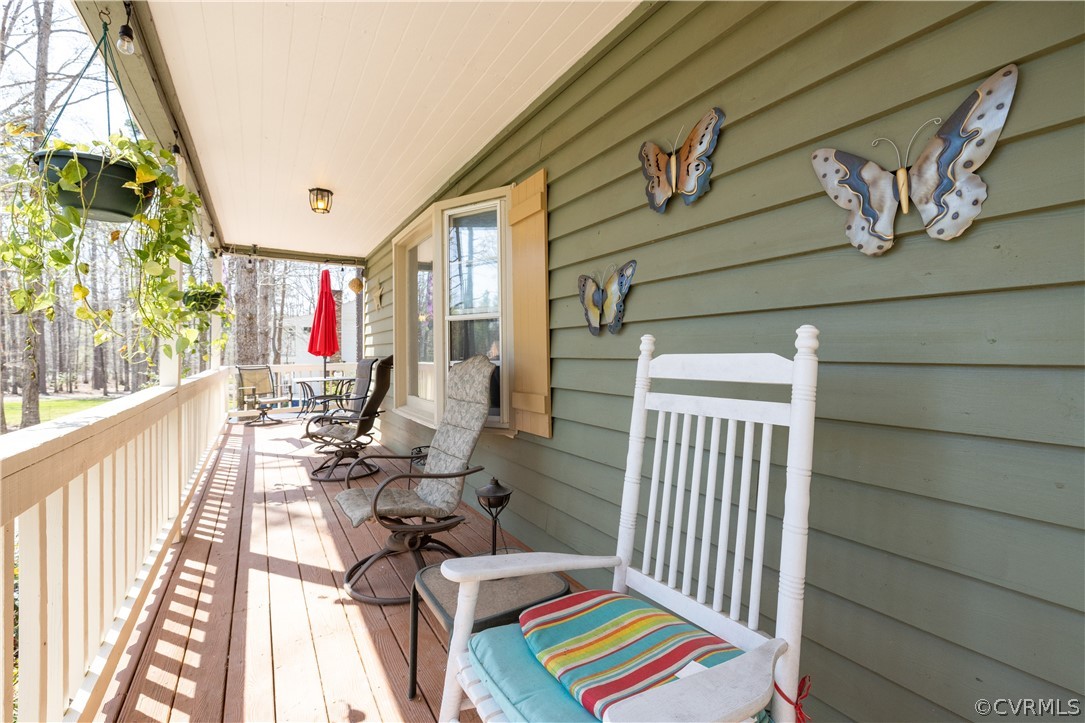 18920 Duval Road Moseley, VA 23120 - Photo 4 of 31 a balcony view with a couch and wooden floor
