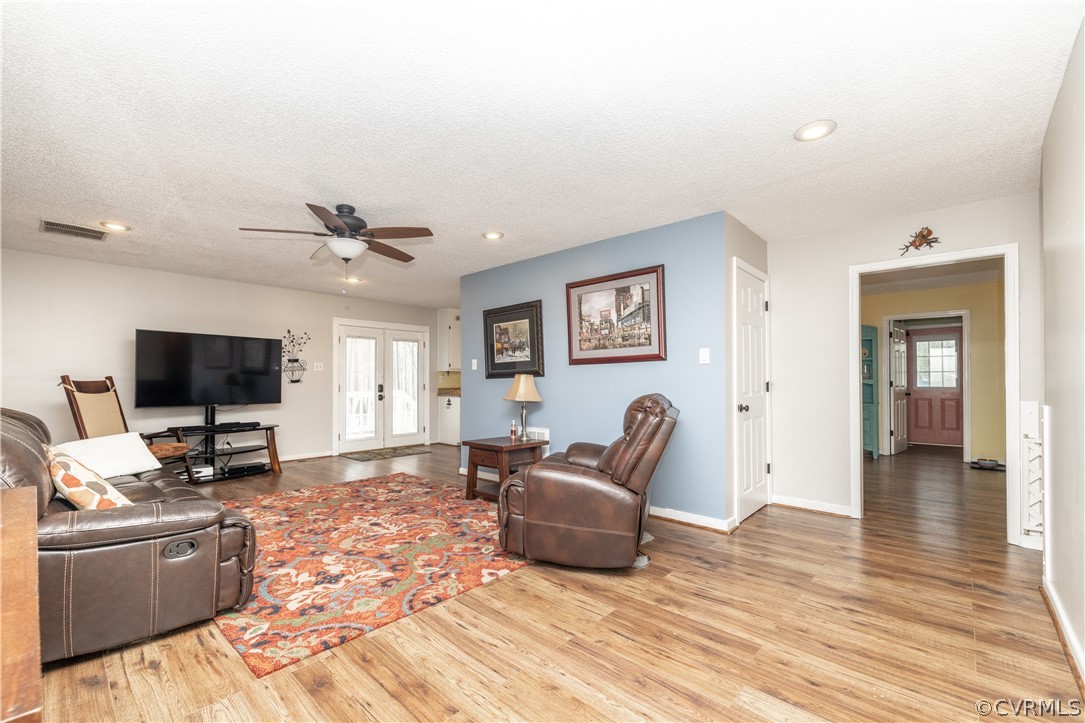 18920 Duval Road Moseley, VA 23120 - Photo 7 of 31 a living room with furniture and a flat screen tv