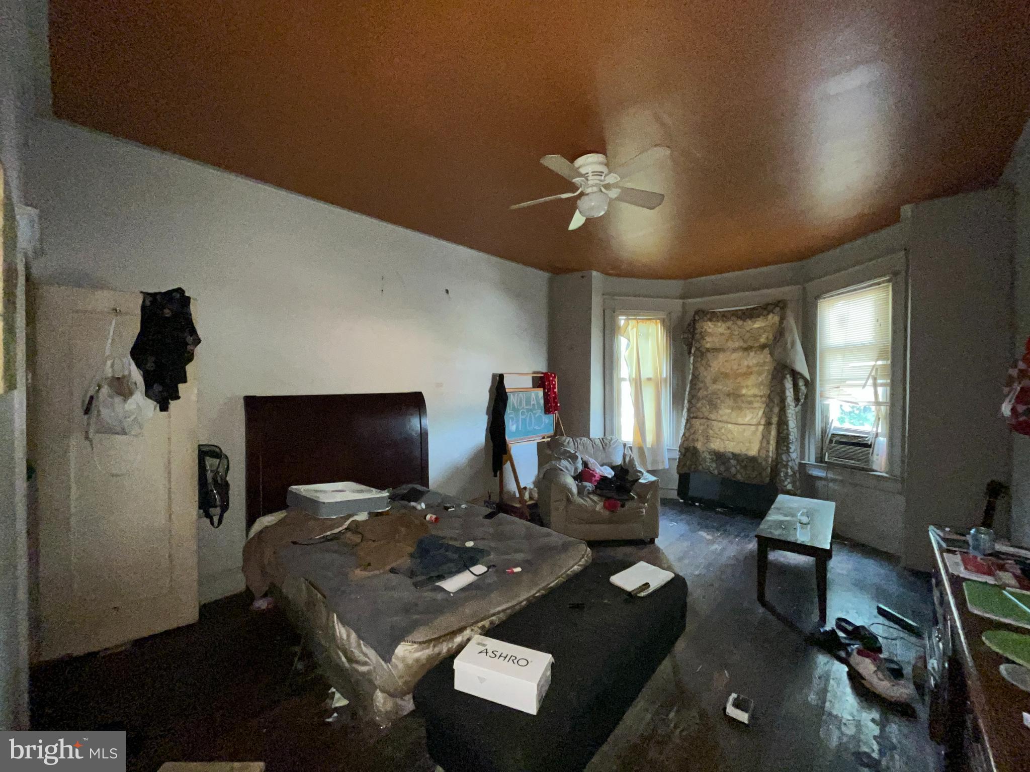 2807 Winchester Street Baltimore, MD 21216 - Photo 13 of 16 a living room with furniture and a flat screen tv