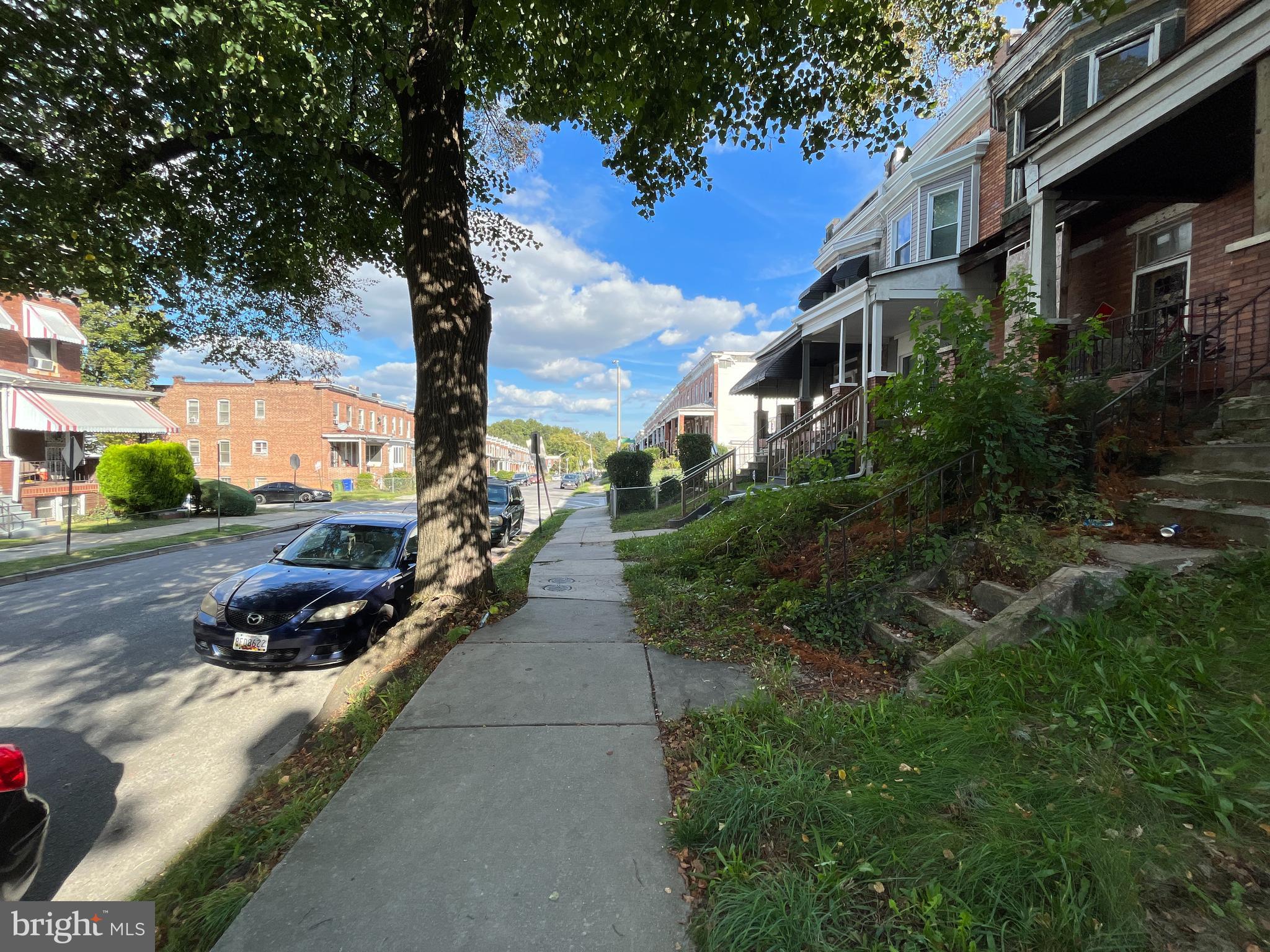 2807 Winchester Street Baltimore, MD 21216 - Photo 2 of 16 a view of a street with some trees